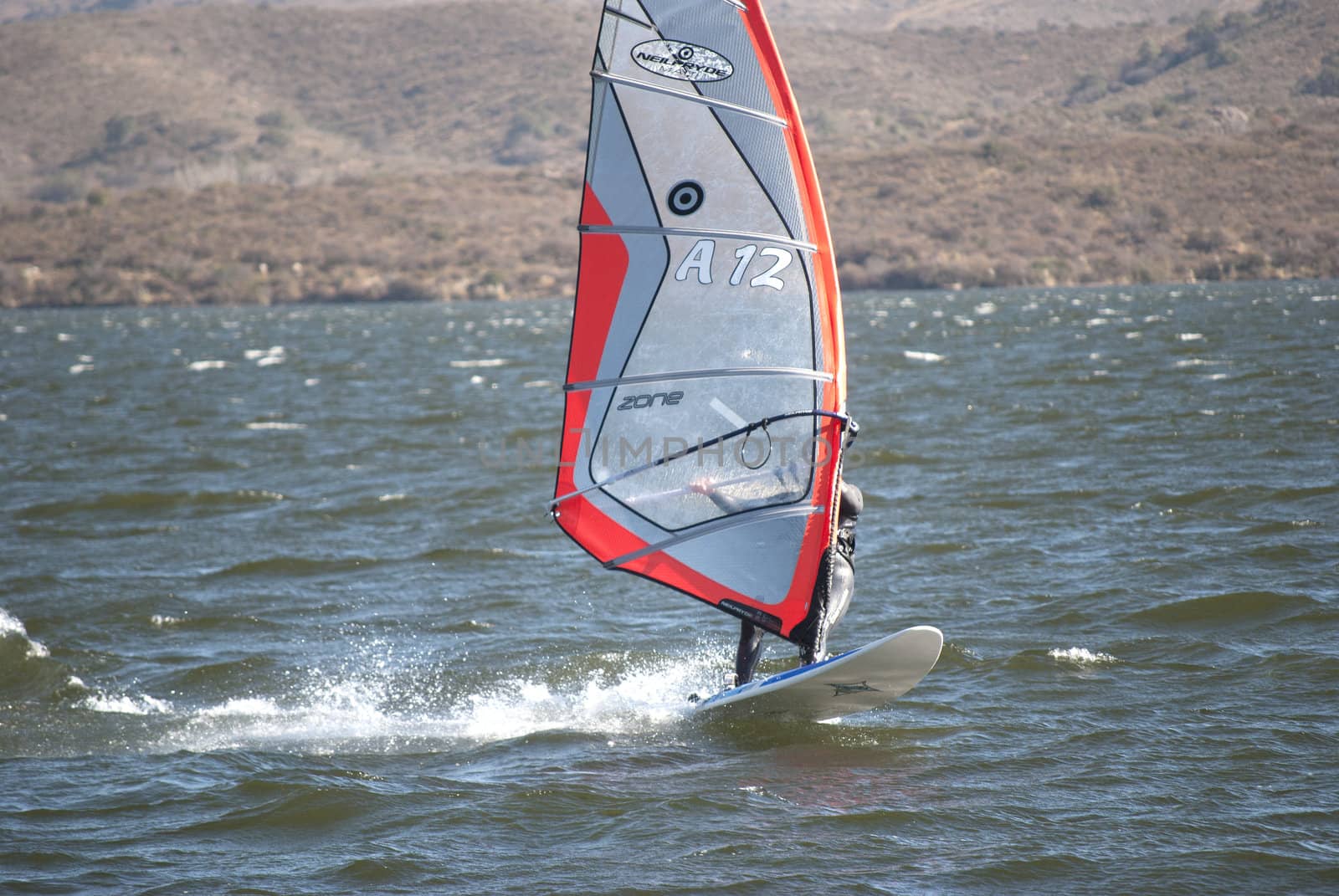 SAN LUIS - ARGENTINA - JULIO 24: A young person practices windsurf in the lake of the dock Florida in Argentinean the 24 of Julio of 2011