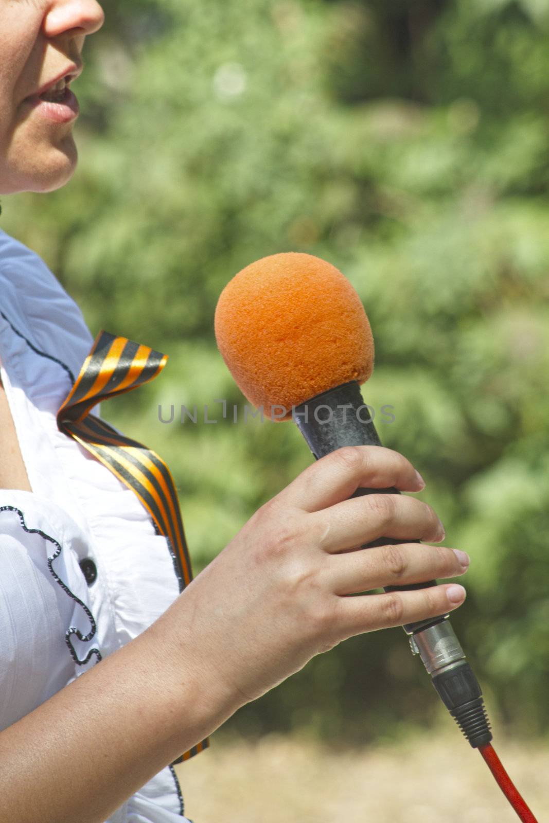 Reporter holds a microphone