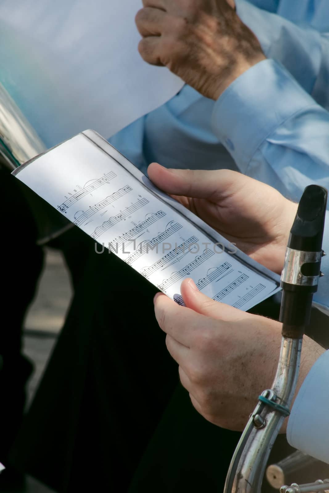 Musician holds in hands the notes