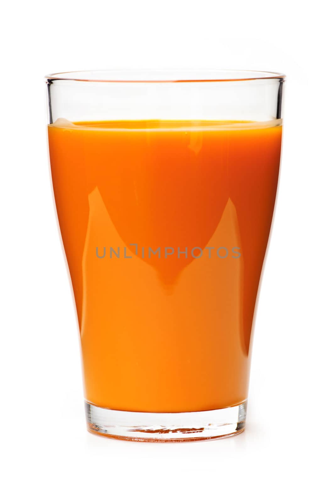 Carrot juice in clear glass isolated on white background