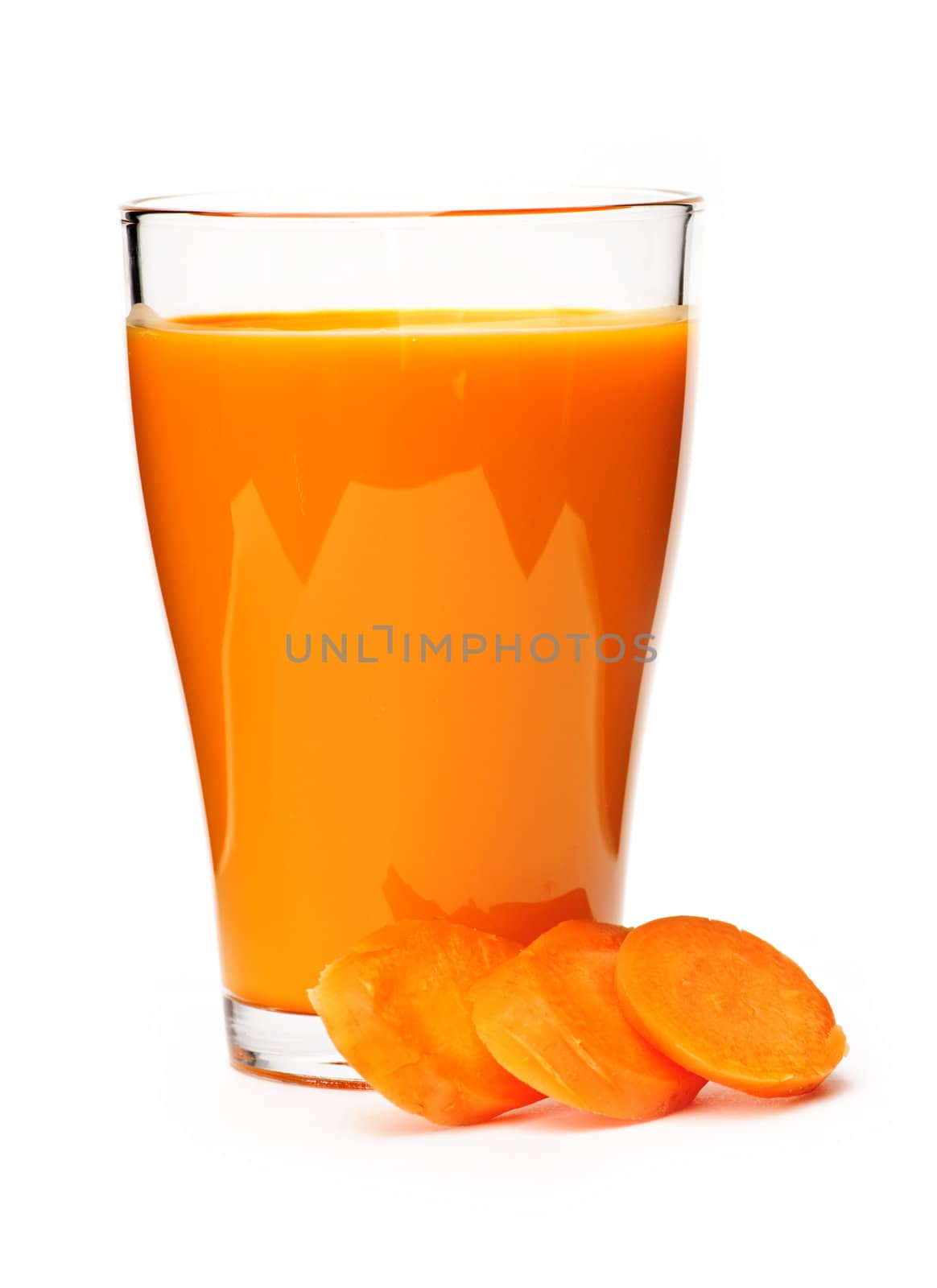 Carrot juice in clear glass isolated on white background