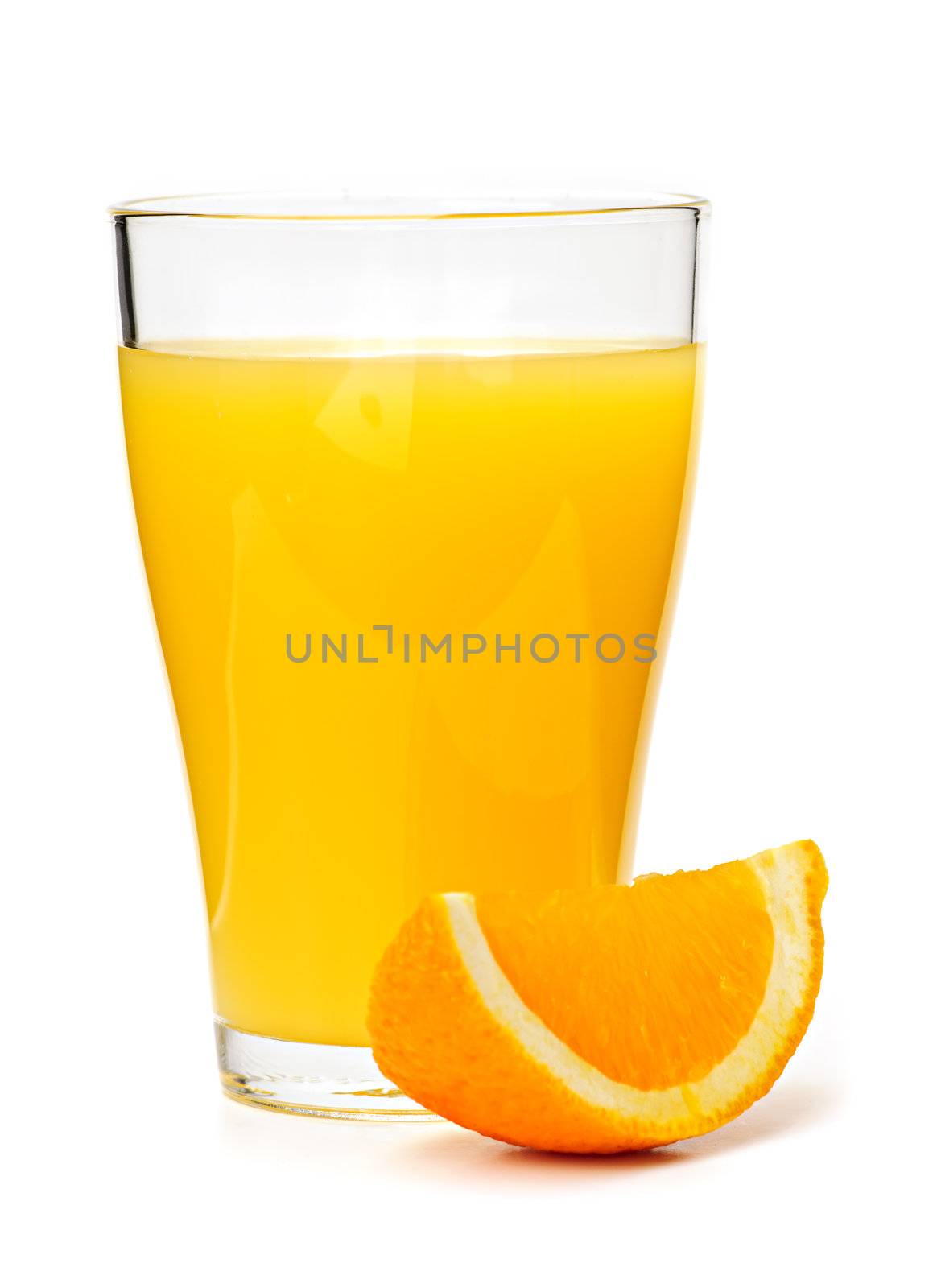 Orange juice in clear glass isolated on white background