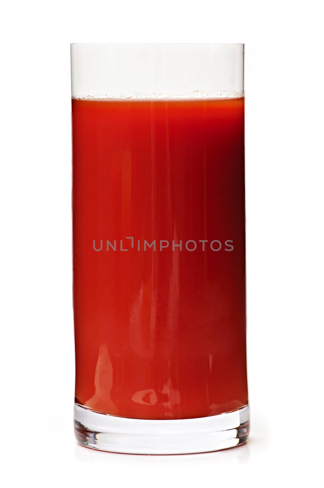 Tomato juice in clear glass isolated on white background