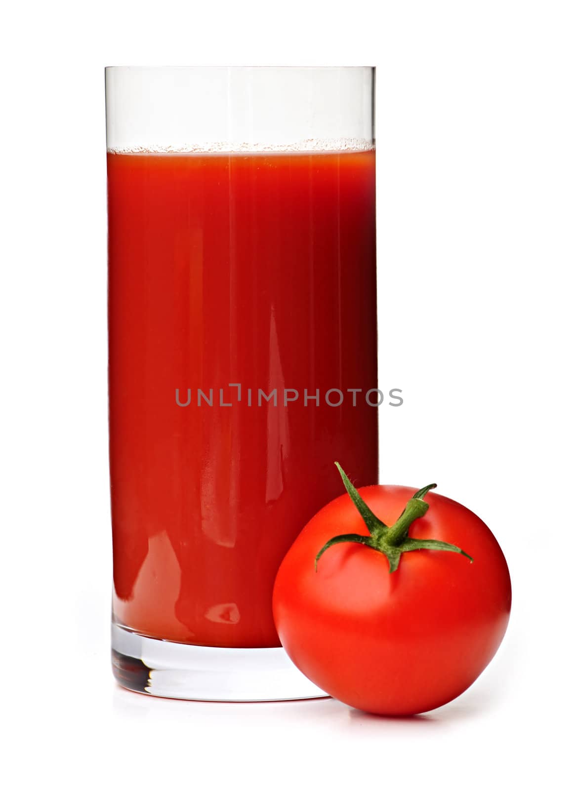 Tomato juice in clear glass isolated on white background
