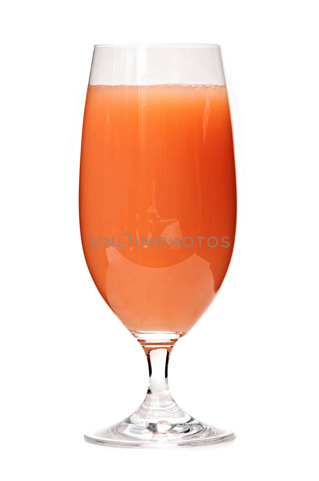 Grapefruit juice in glass by elenathewise