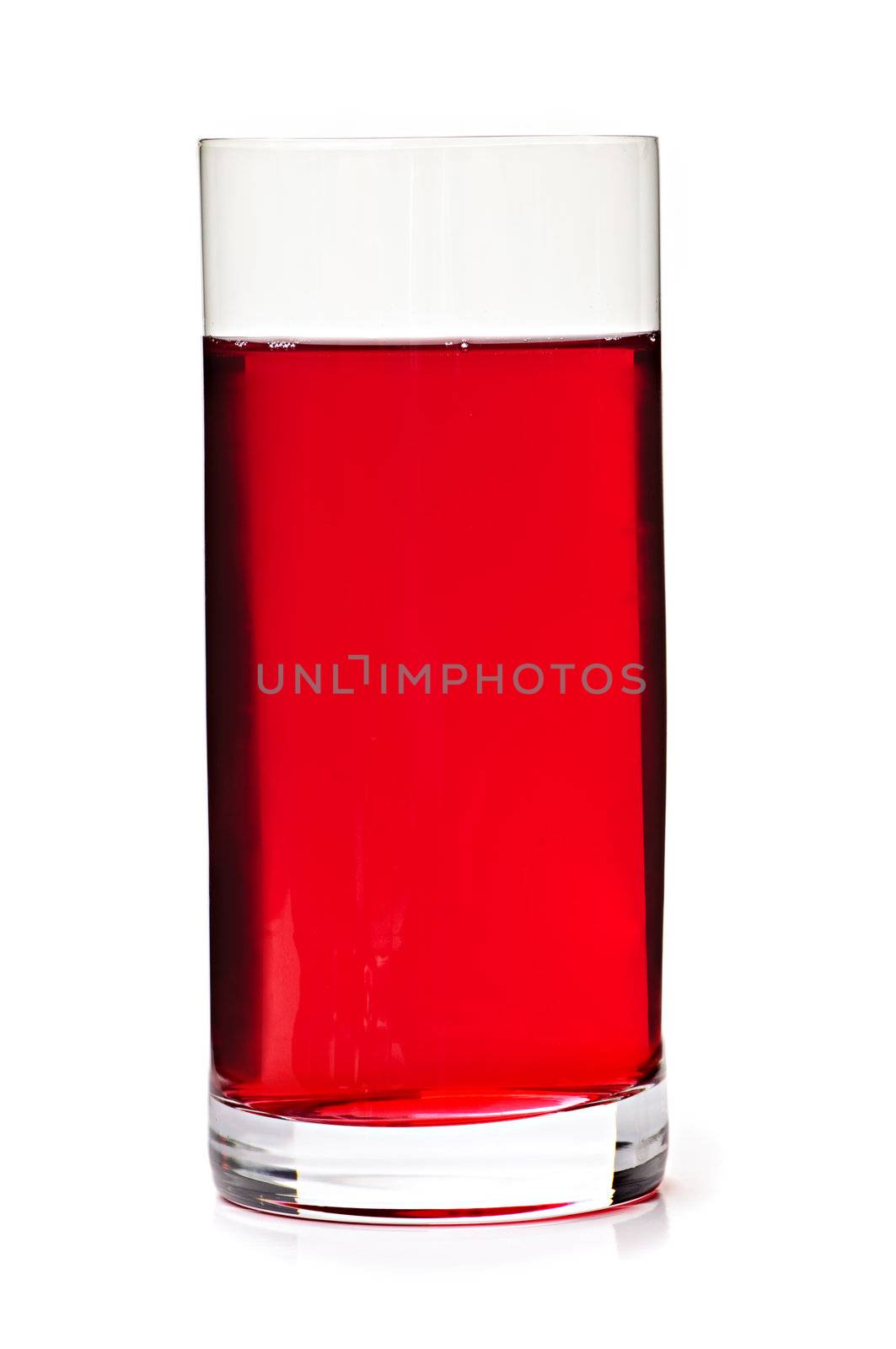 Cranberry juice in clear glass isolated on white background