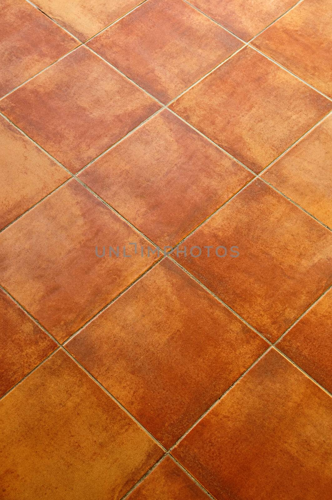 Closeup of square terracotta ceramic tile floor background