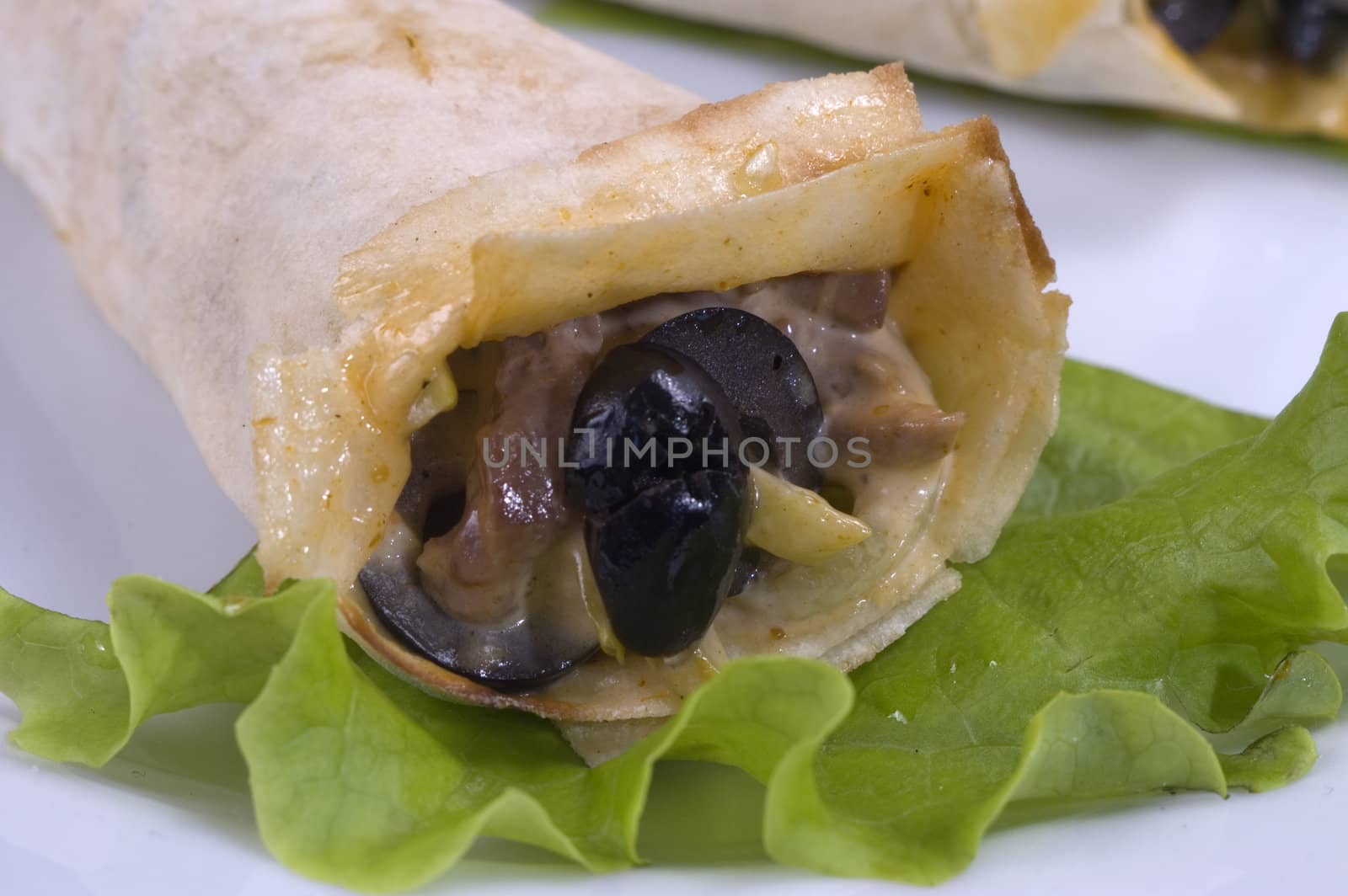 Pancakes with mushrooms, olives and green salad.