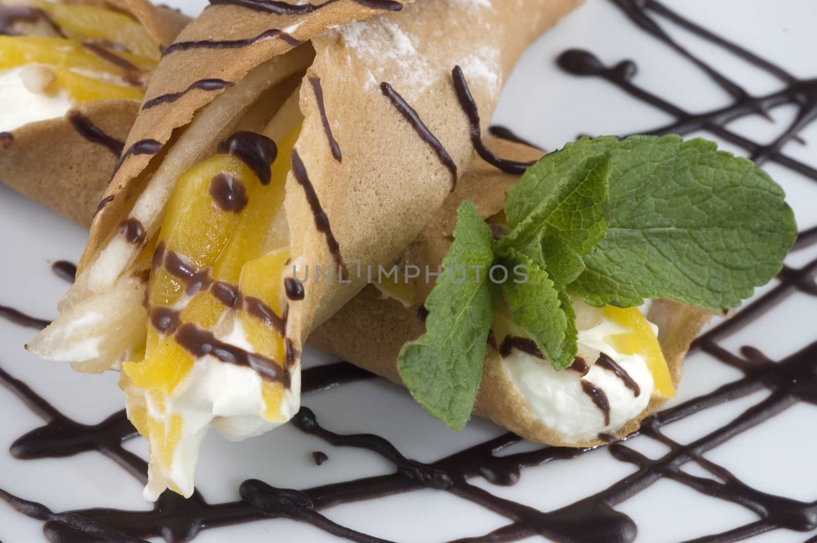 
Pancakes with fruit, whipped cream in chocolate.
