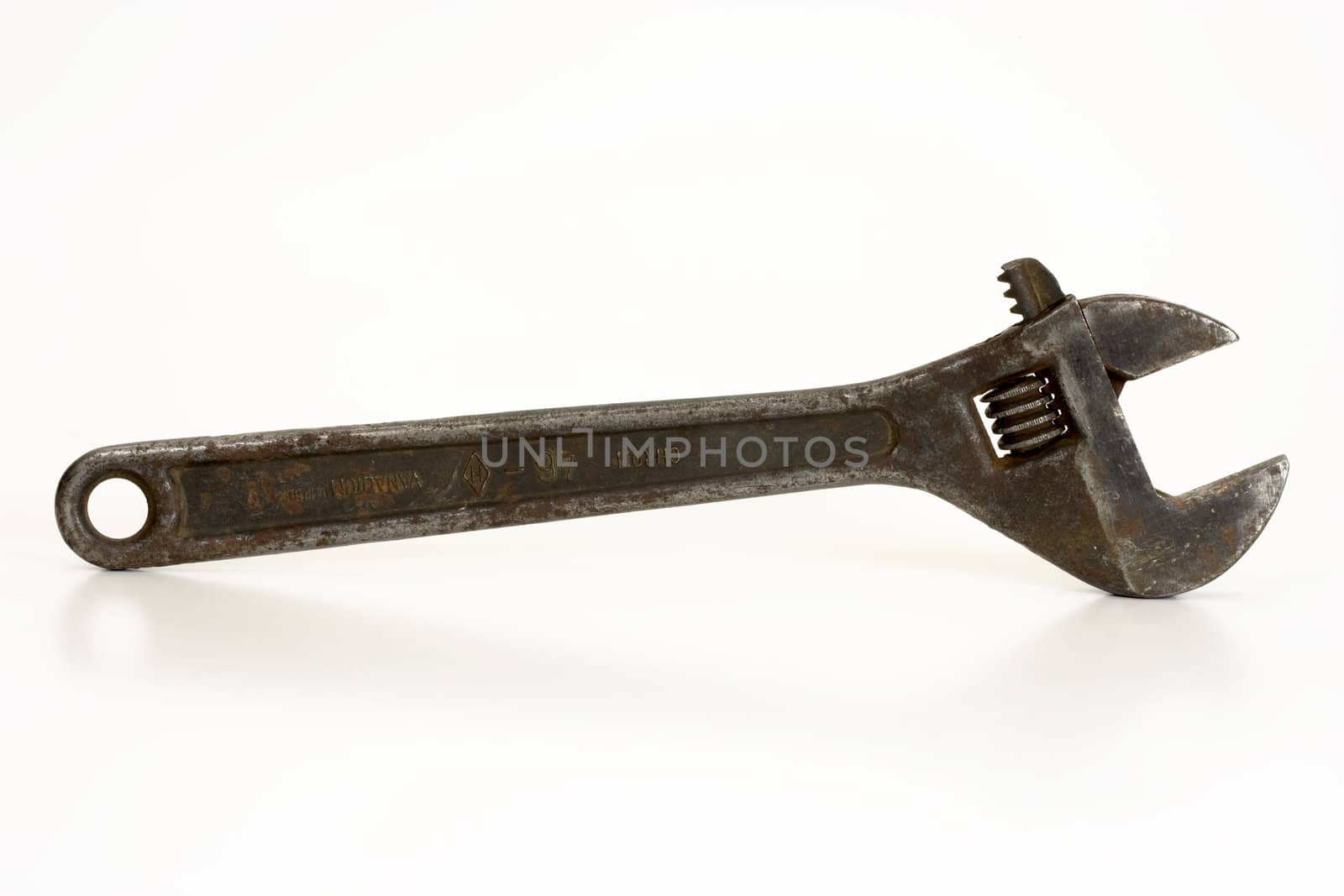 Old spanner on a white background.