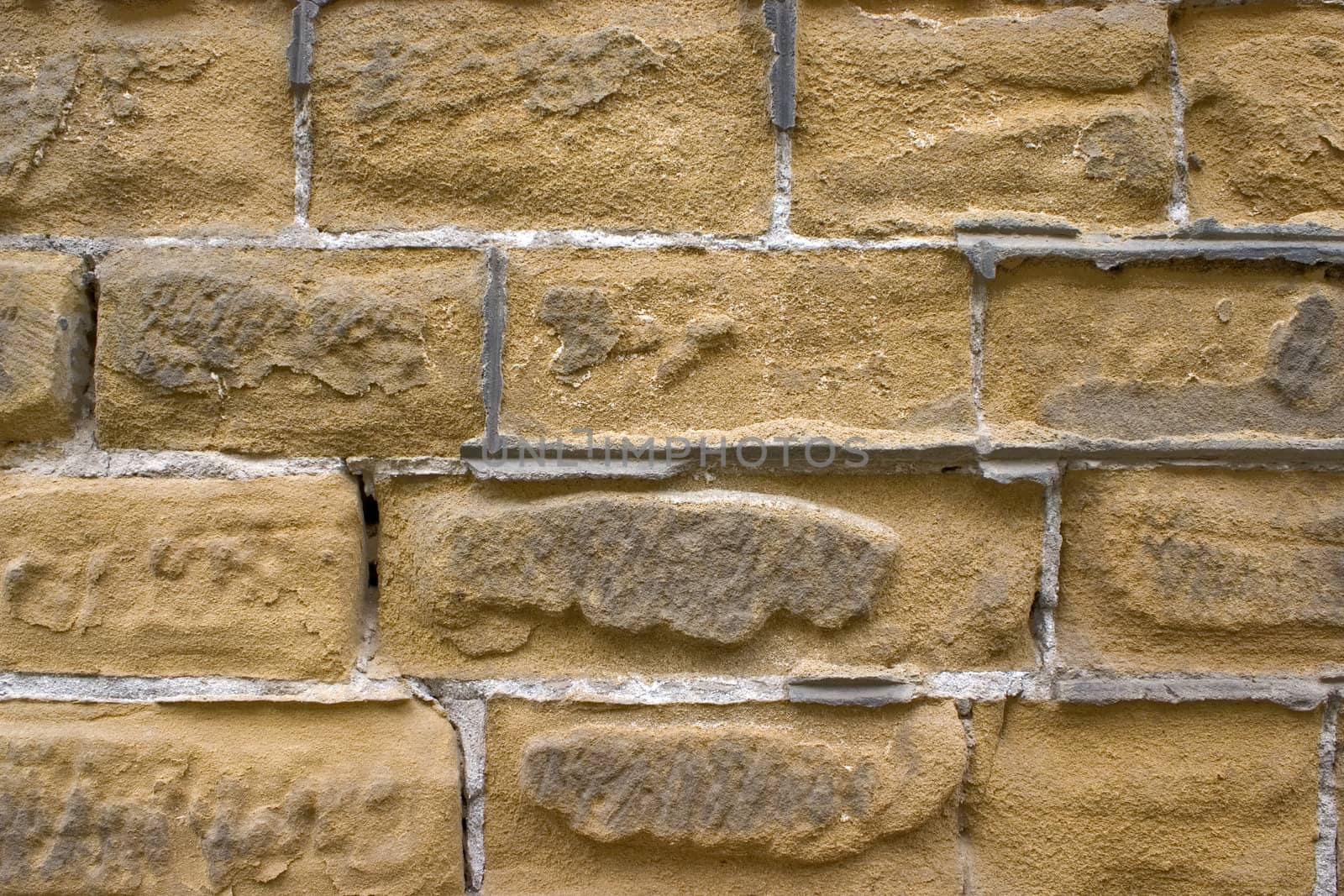 Old wall of a yellow brick.