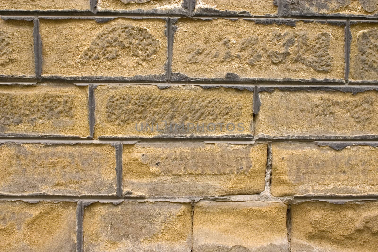 Old wall of a yellow brick.