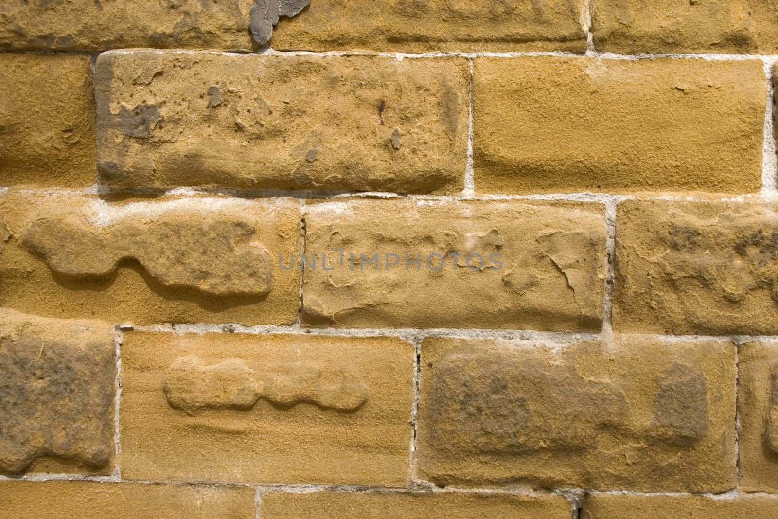 Old wall of a yellow brick.