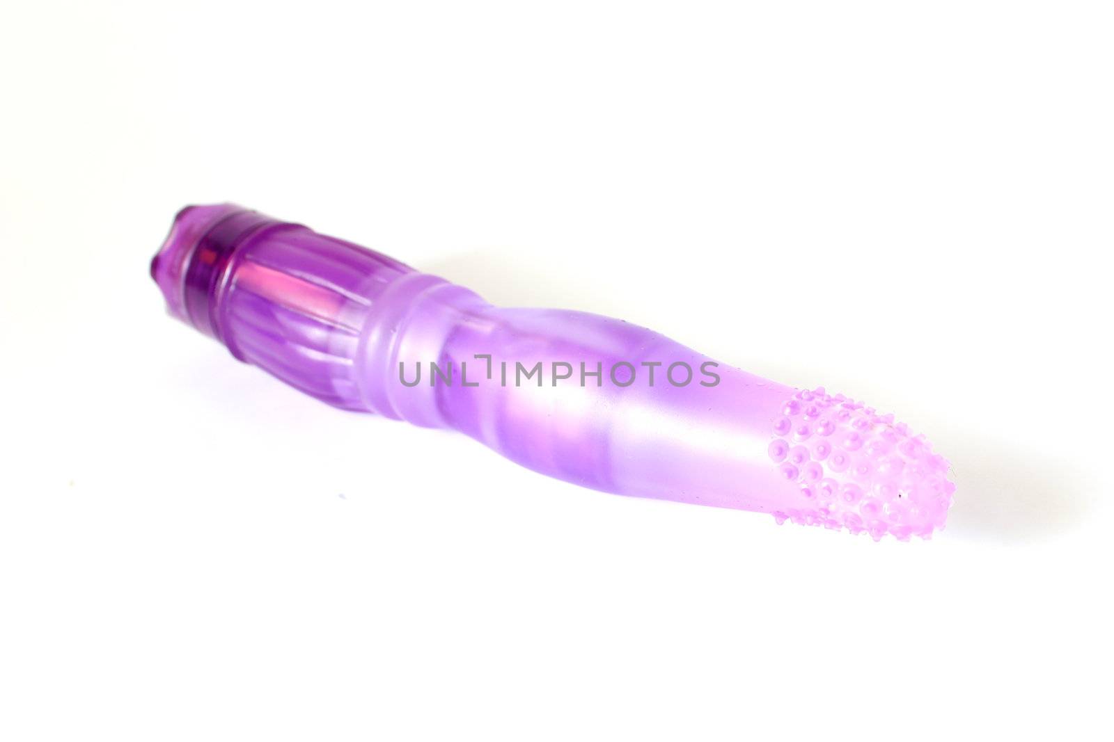 Isolated purple dildo used for adult entertainment.