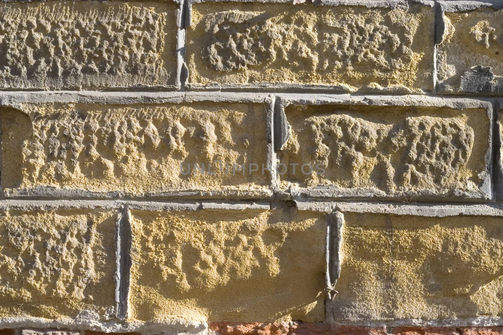 Old wall from a yellow brick.