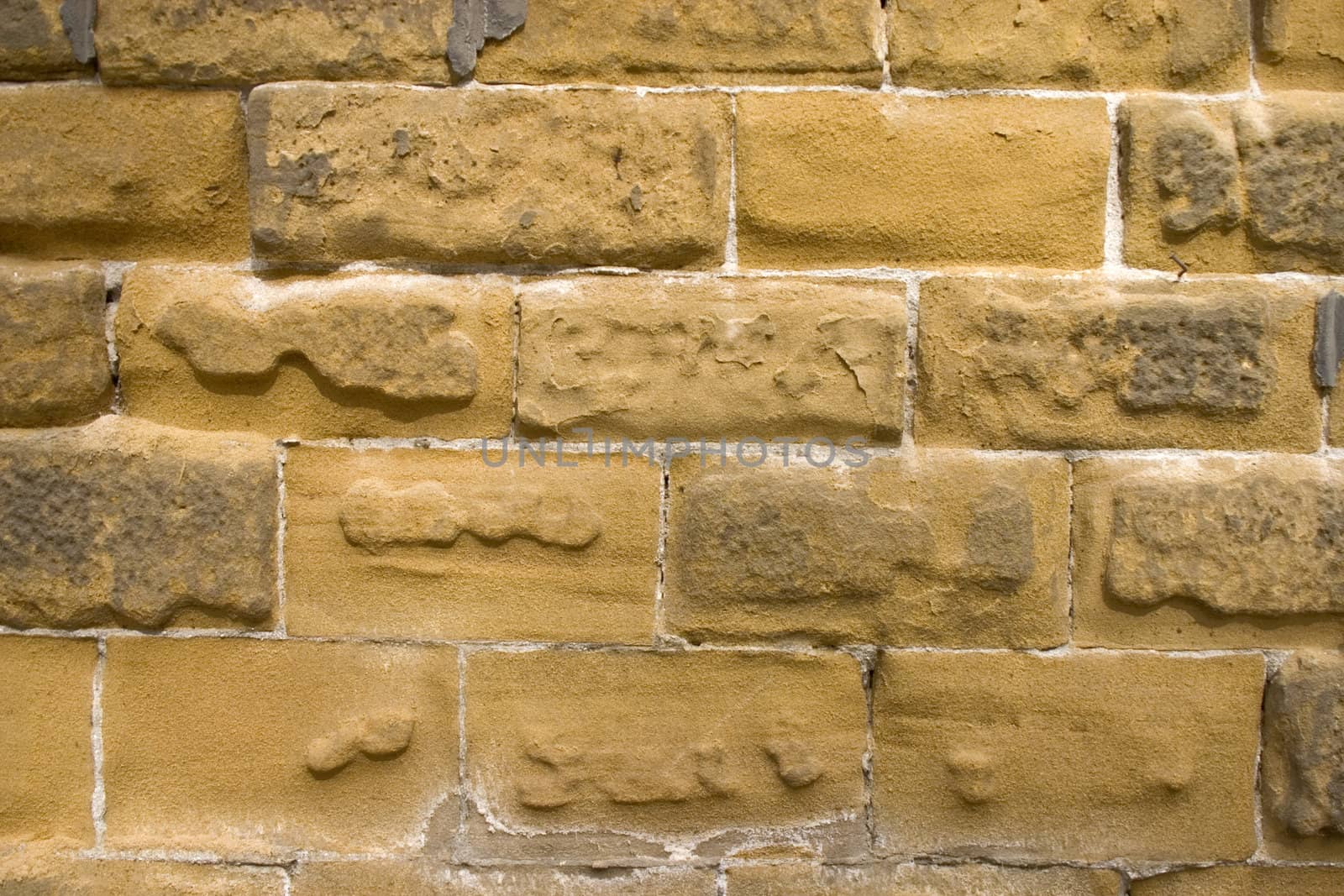 Old wall of a yellow brick.
