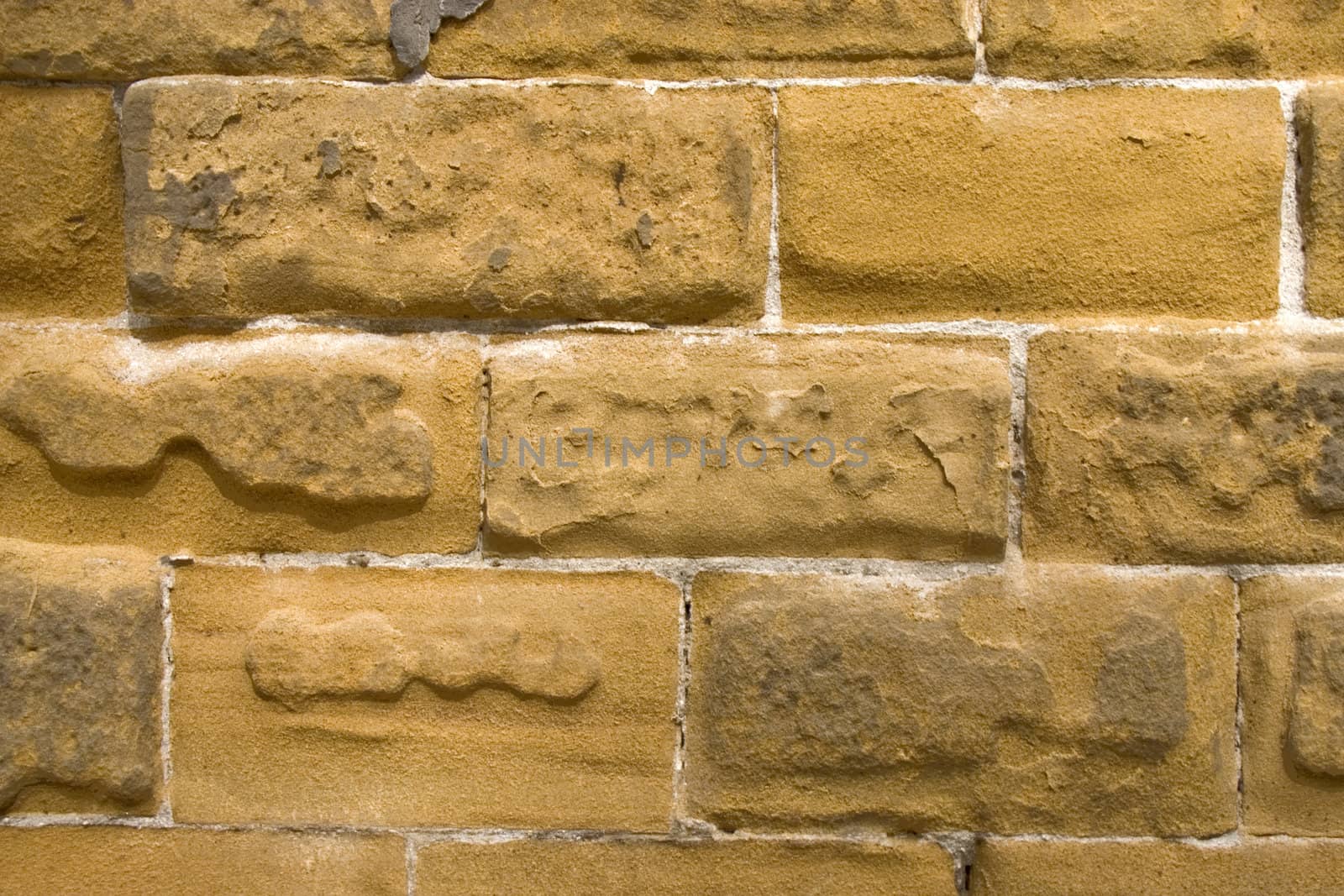 Old wall of a yellow brick.
