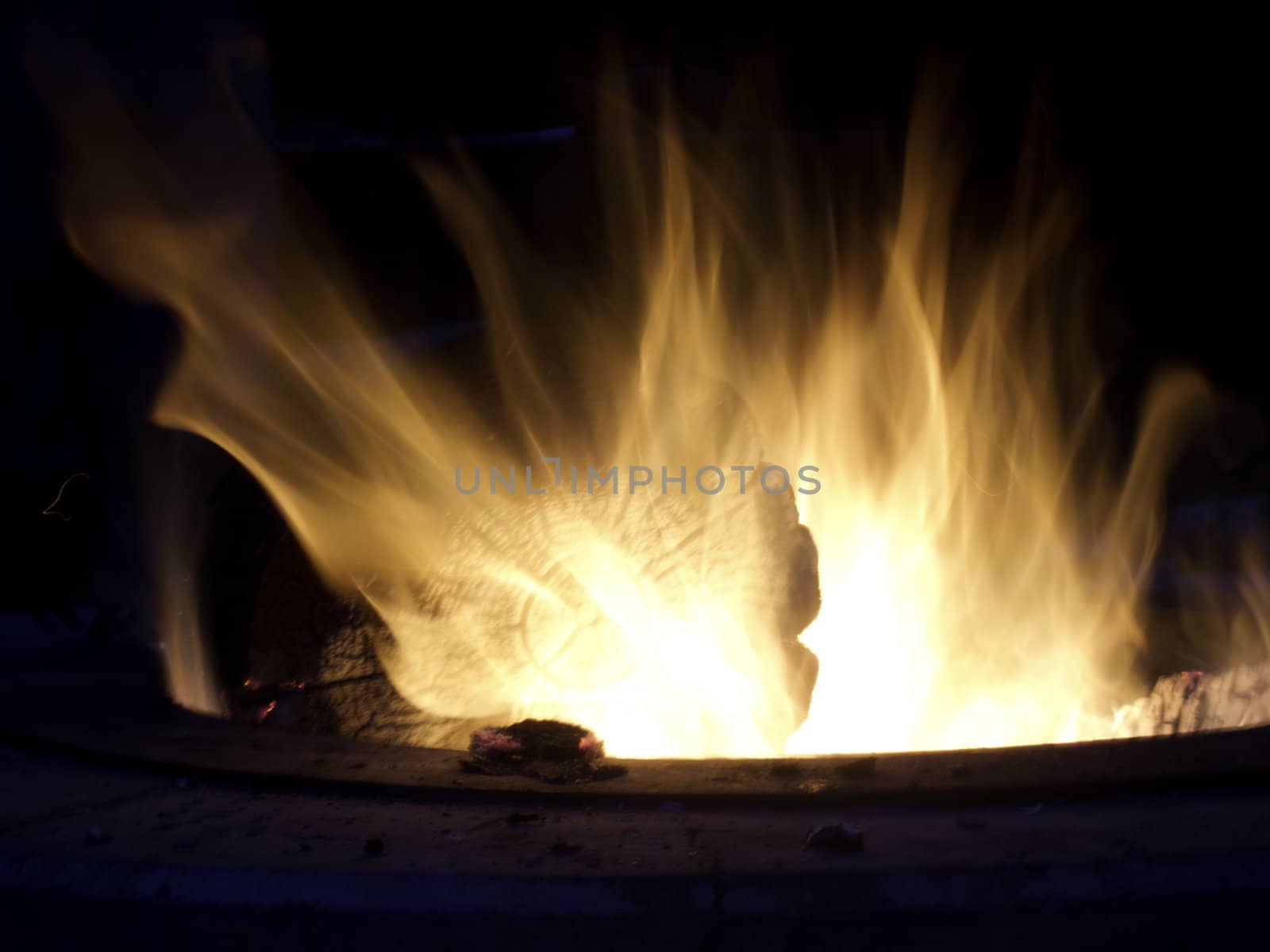 campfire long exposure with outline of log by kjcimagery