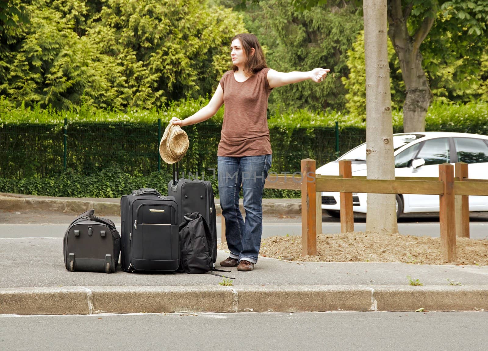 young woman doing the hitchhiking