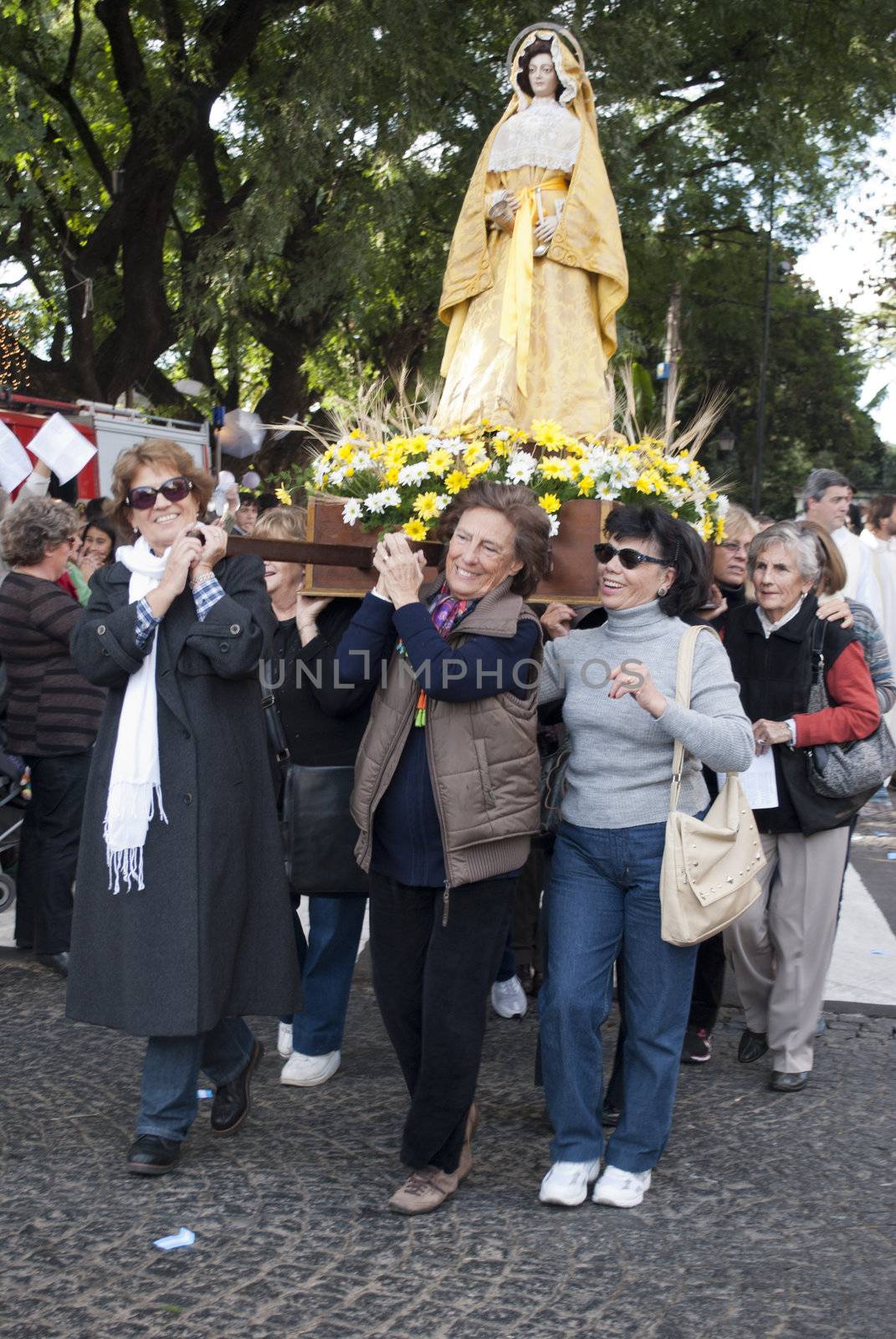 Argentina - Buenos Aires - May 15, 2012:women taking the Virgin during prosecion in commemoration of the celebration of San Isidro Labrador in the cathedral that bears his name located in the province of Buenos Aires