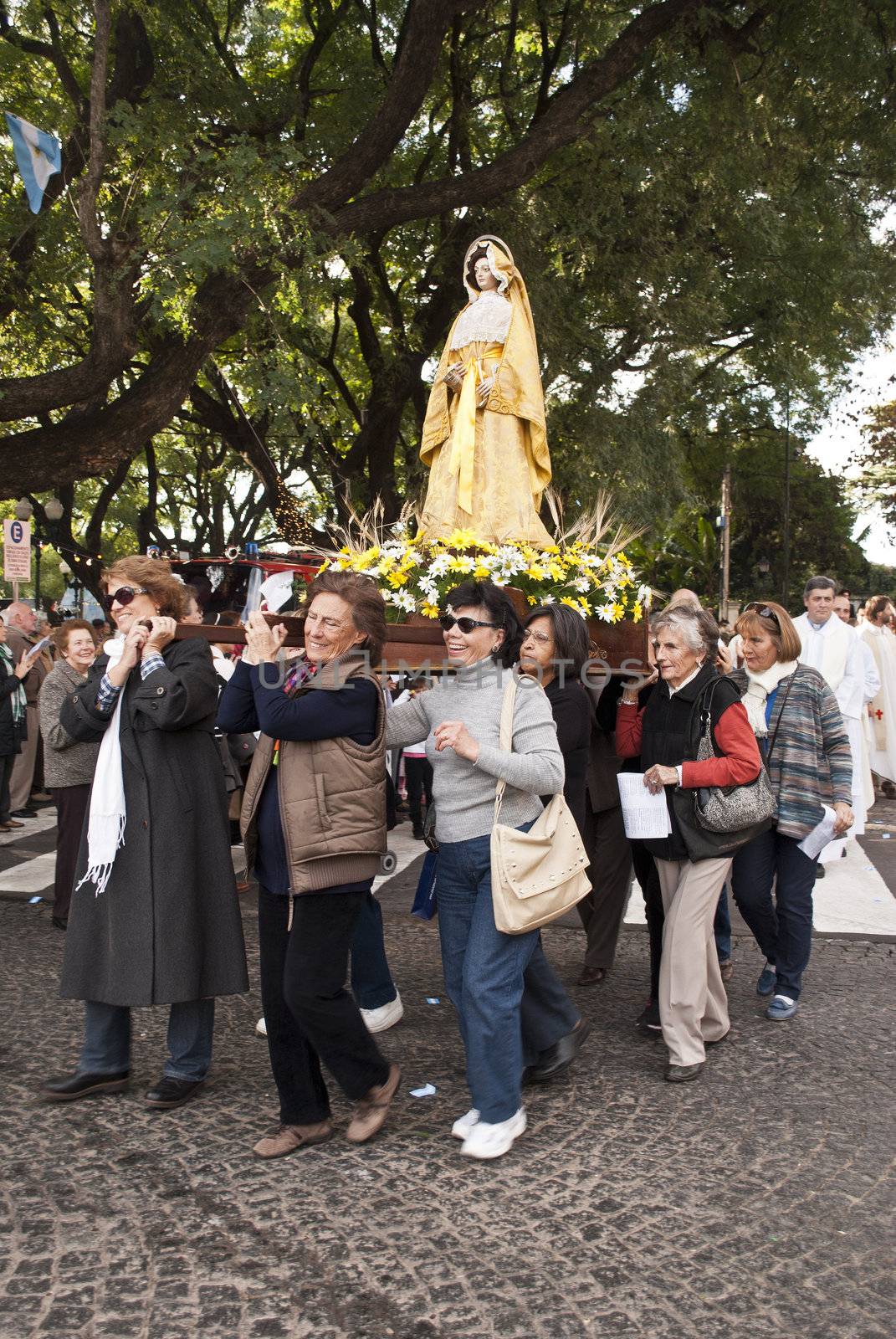 Argentina - Buenos Aires - May 15, 2012:women taking the Virgin during prosecion  in commemoration of the celebration of San Isidro Labrador in the cathedral that bears his name located in the province of Buenos Aires