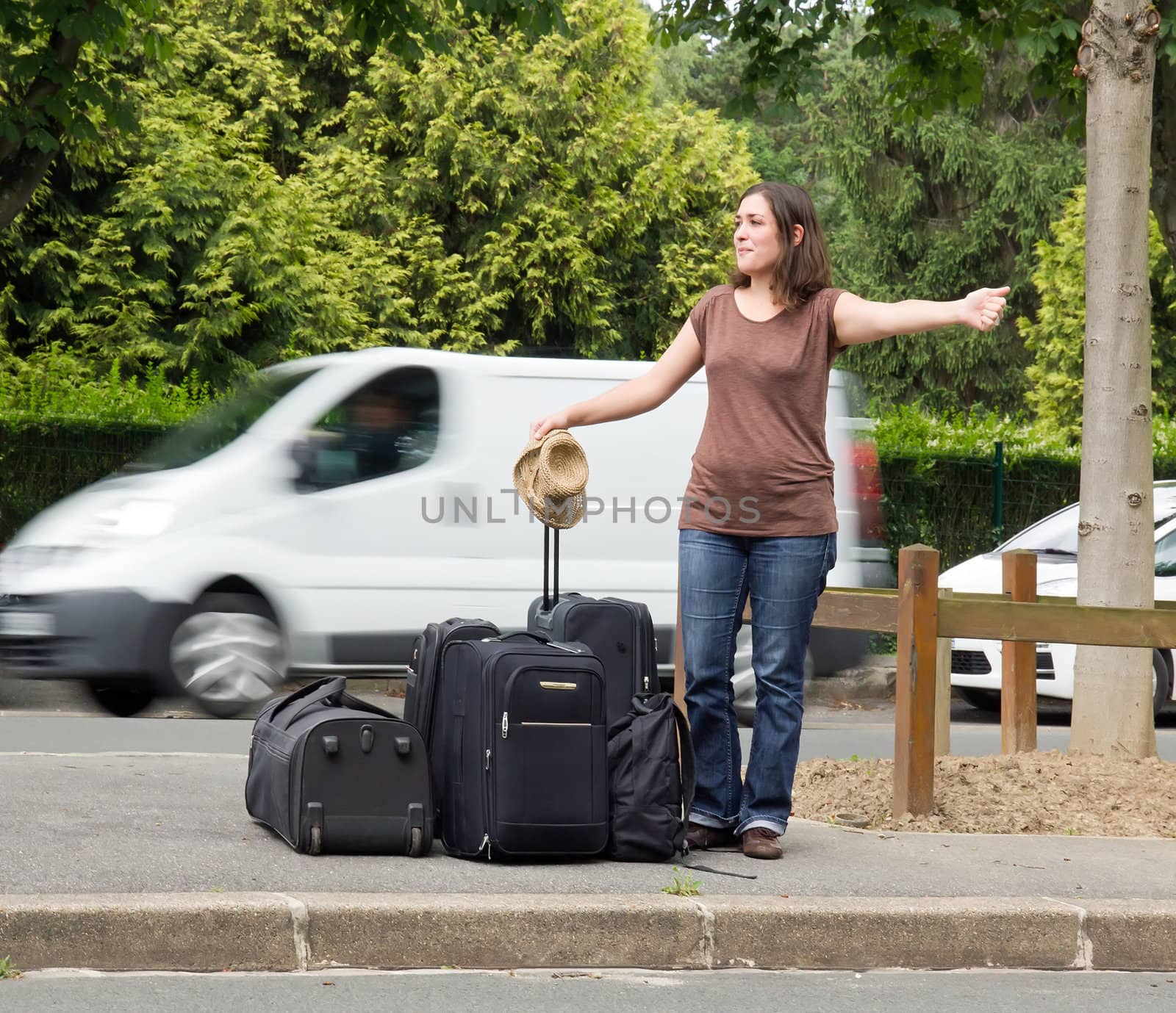 young woman doing the hitchhiking