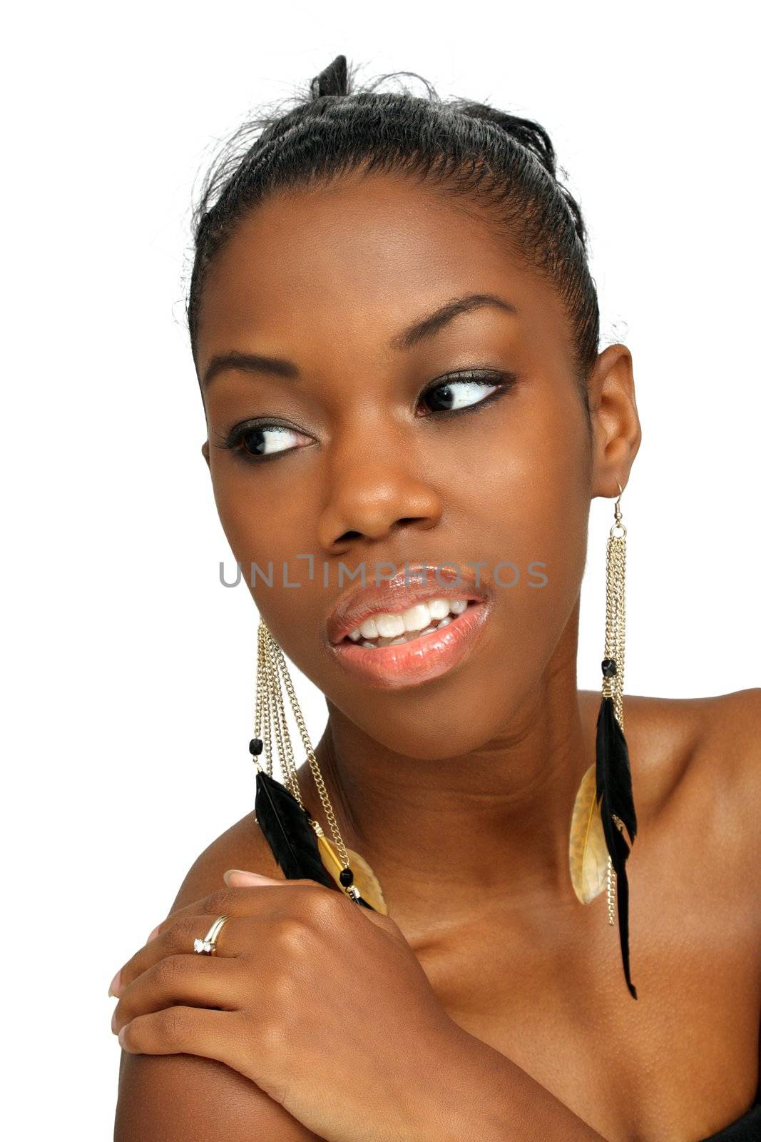 A studio close-up of a lovely young black woman looking toward frame left.