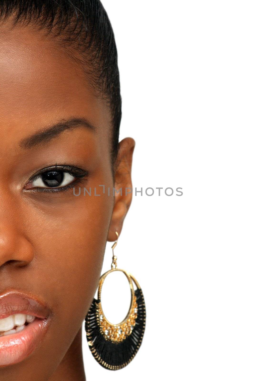 A studio close-up of a lovely young black woman looking up toward frame right.
