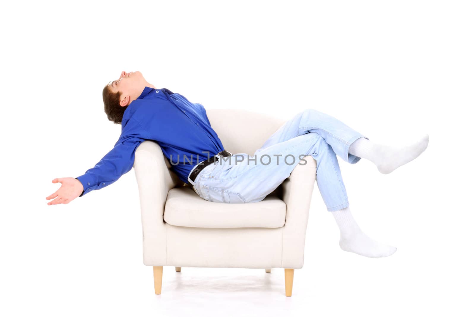 happy teenager relaxing in a chair. isolated on the white background