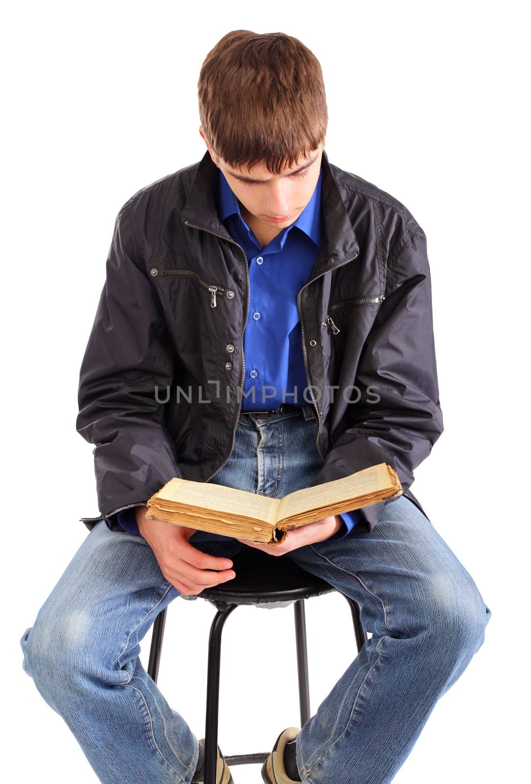 teenager reads old book isolated on the white background