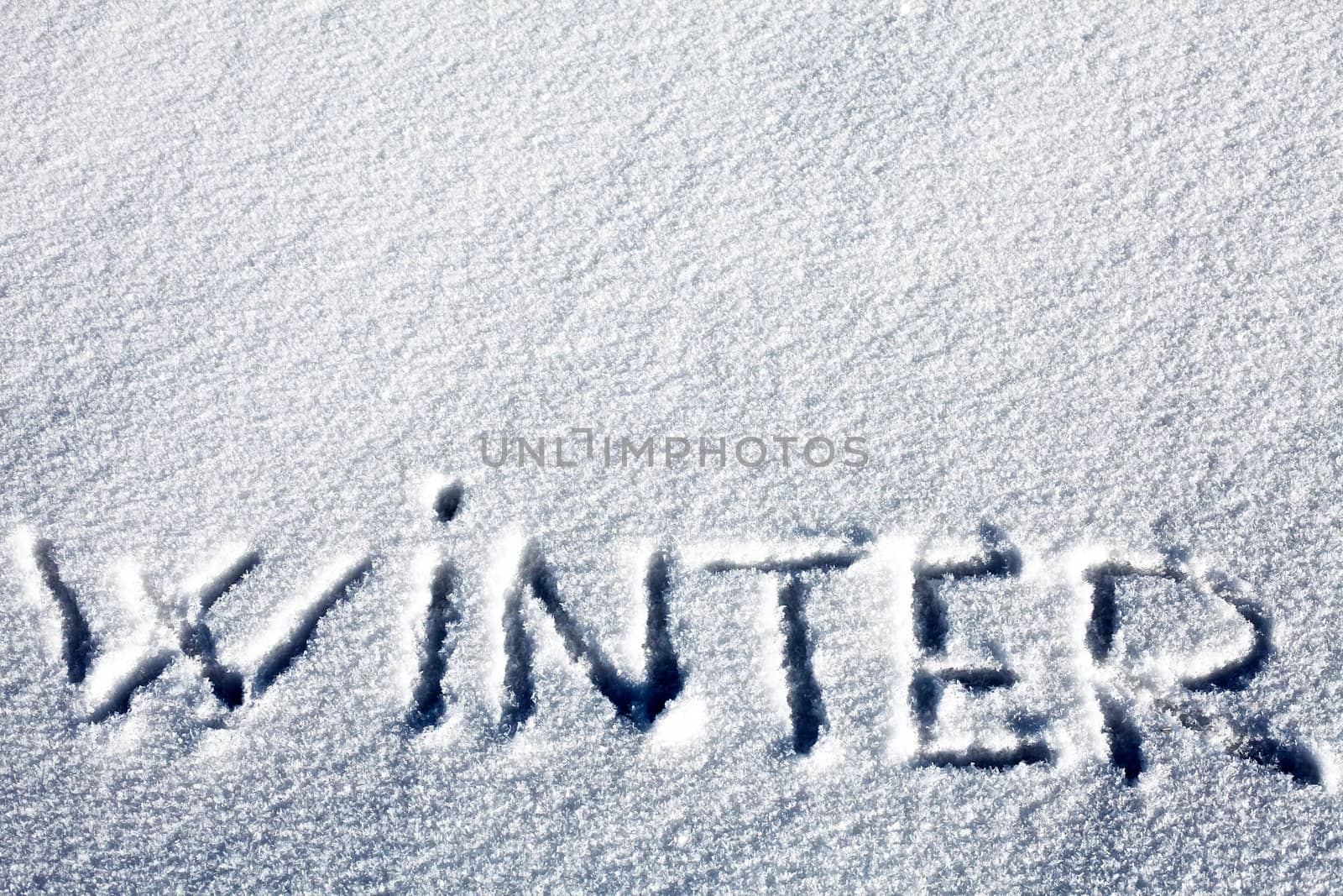 Handwritten Inscription "Winter" on the Snow