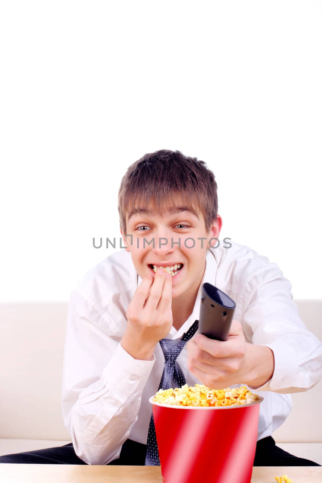 Happy Teenager with Remote Control and Popcorn