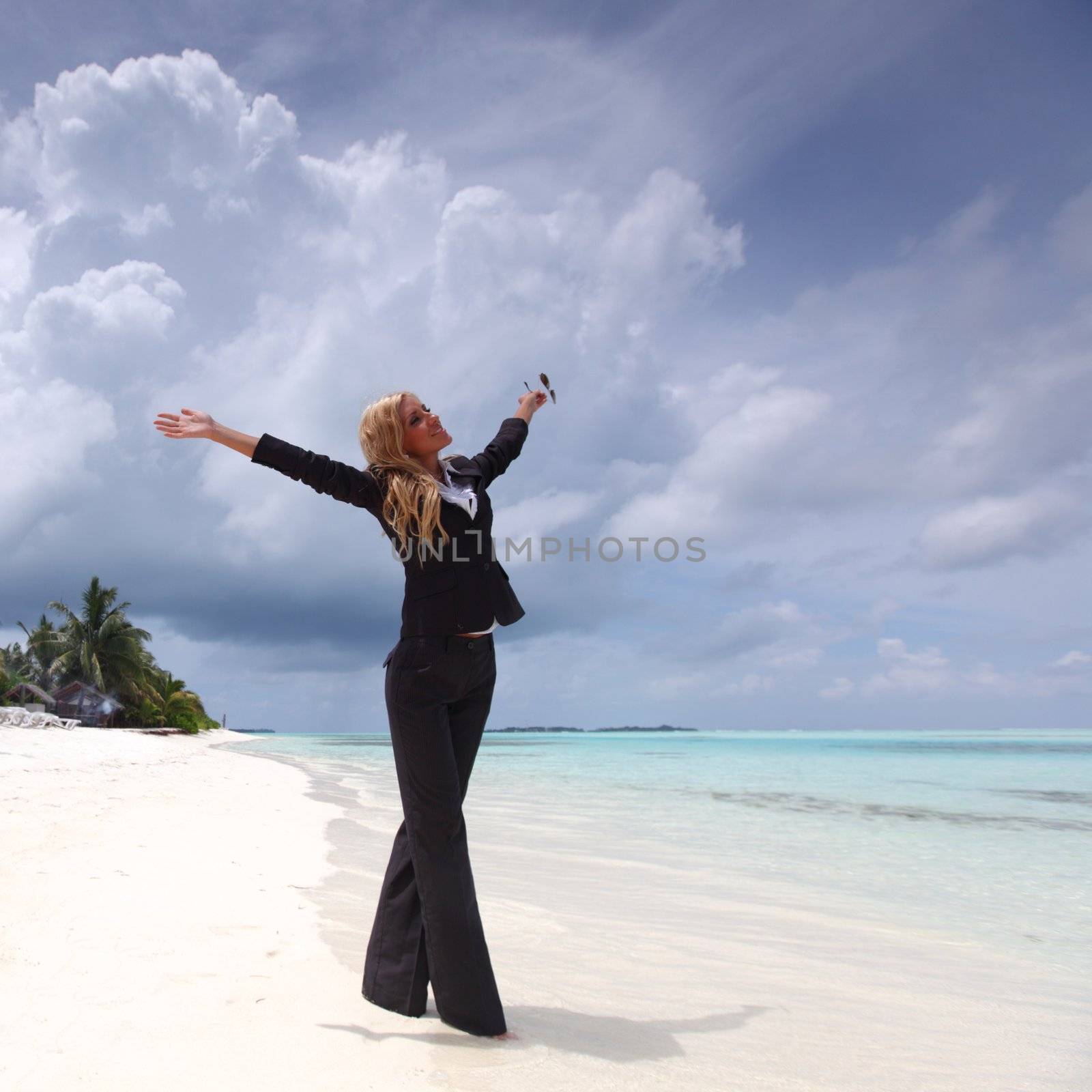 happy business woman on the ocean coast by Yellowj