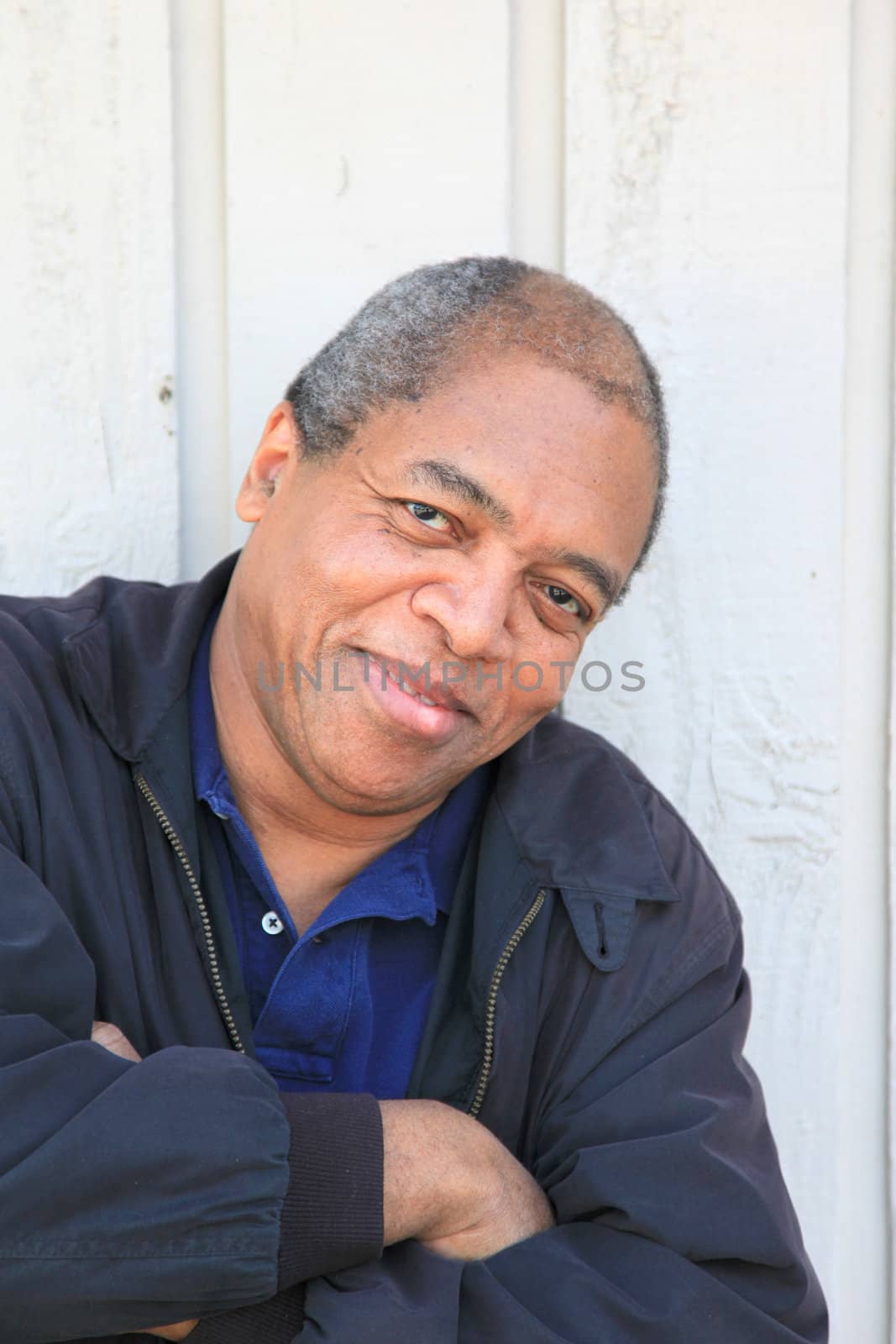 African American male posing outside.