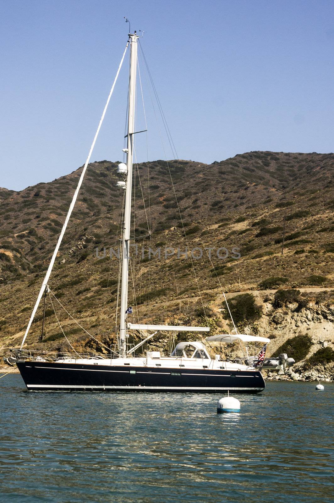 Sailboat moored at Santa Catalina Island in the quiet bay of Catalina Harbor