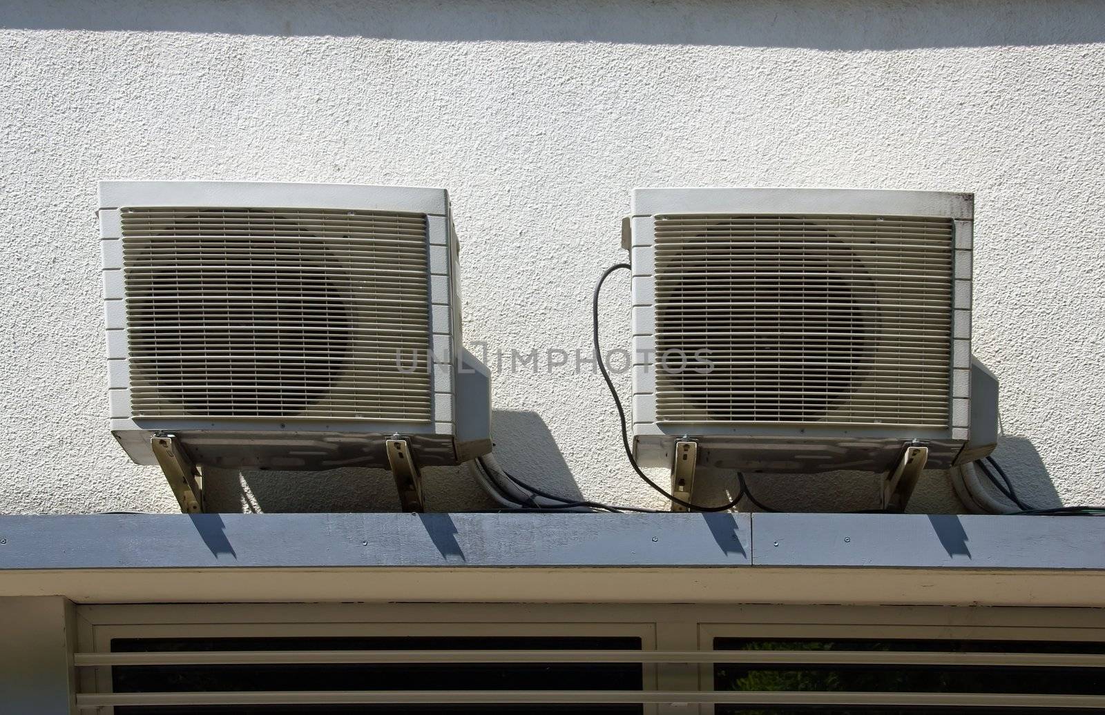 two outdoor fans, ready to face the heat