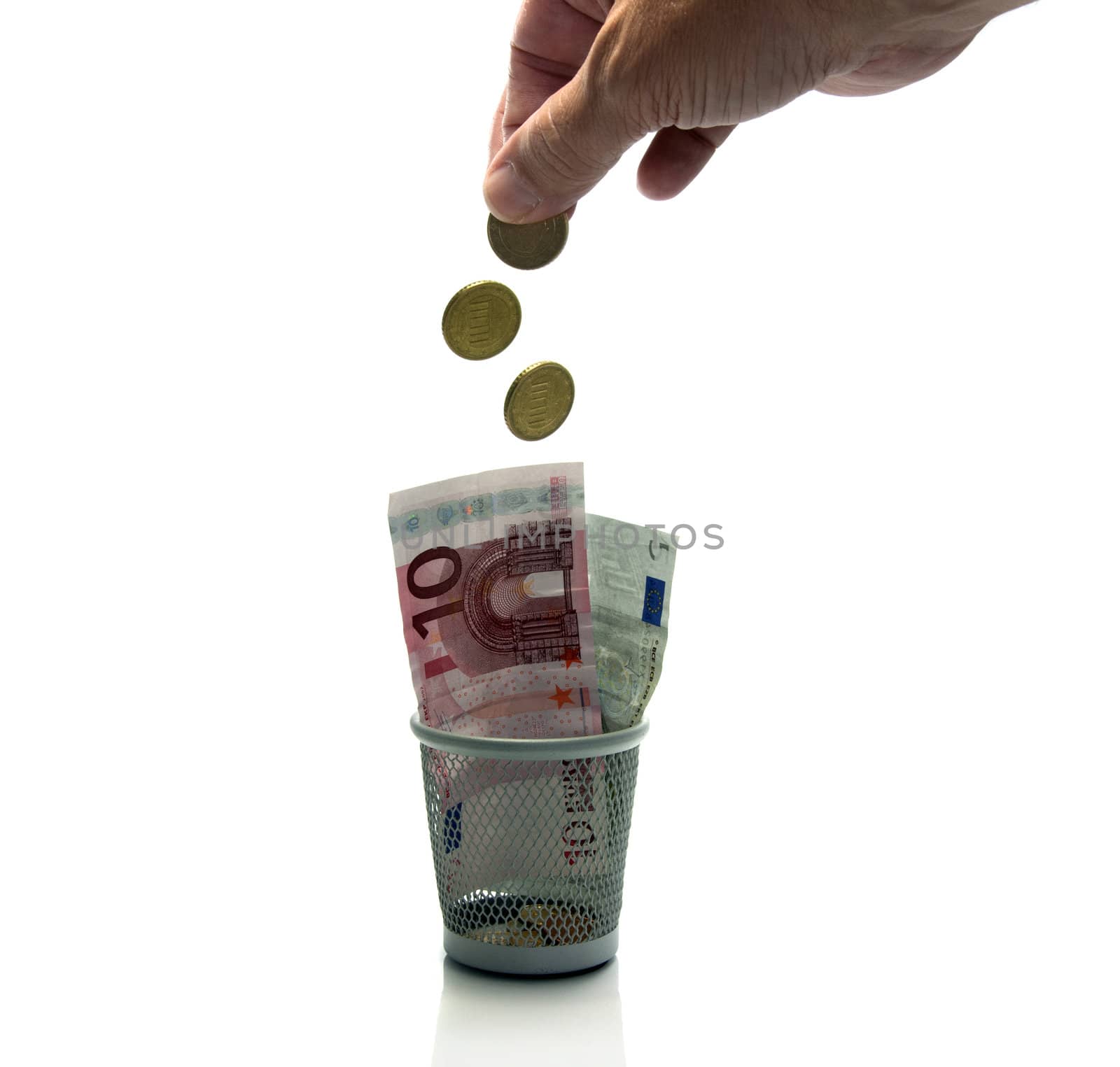 hand throws euro money in container