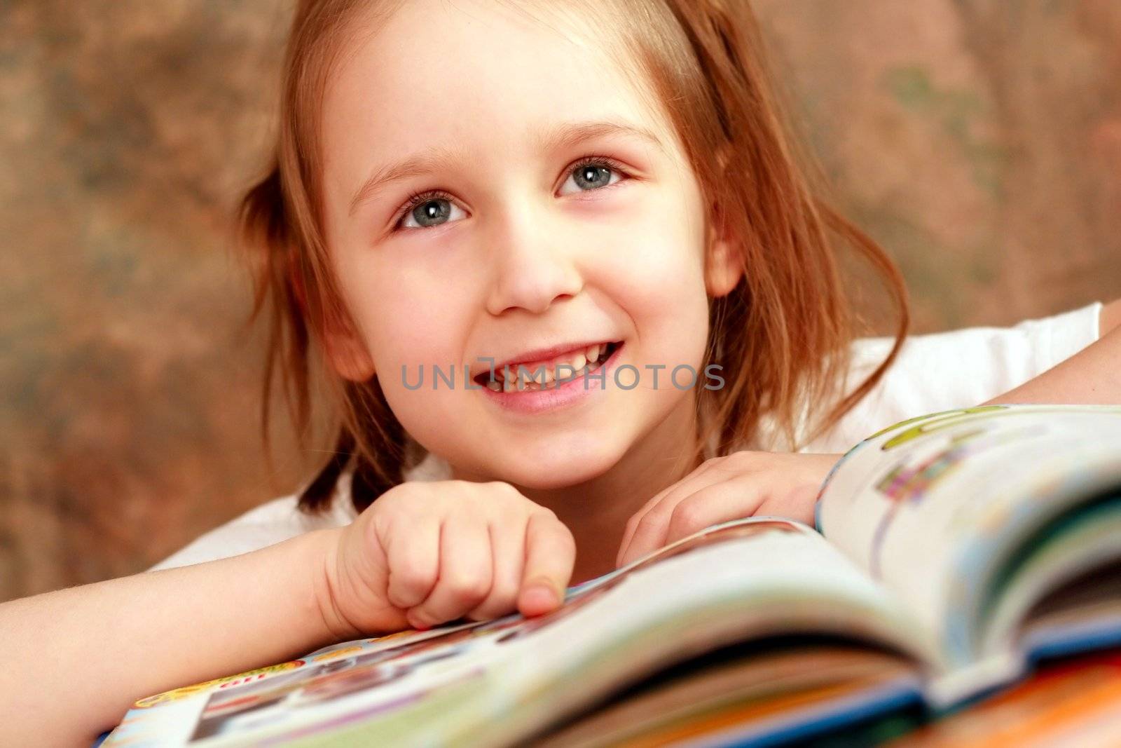 Smart girl reading a book and learns