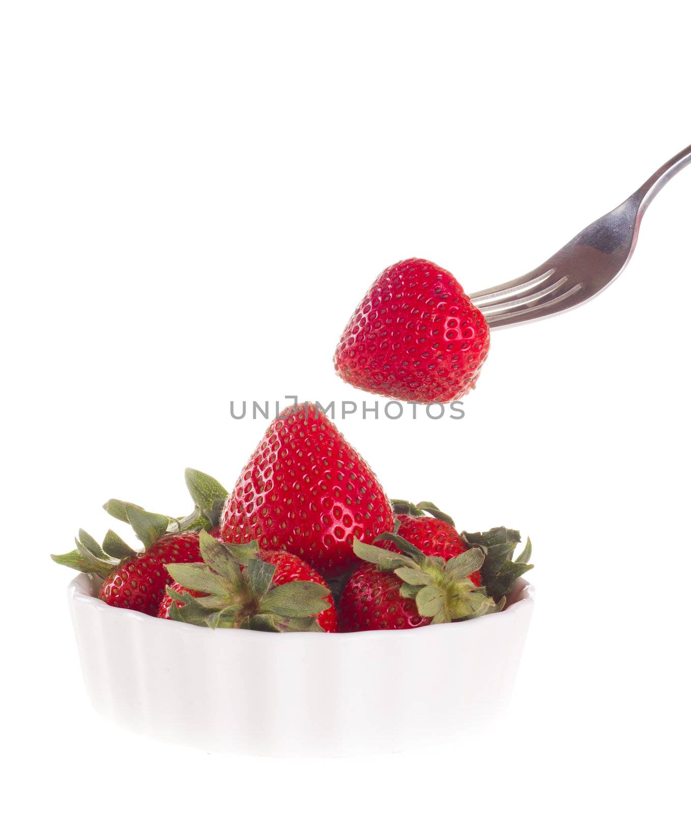 strawberry with fork, isolated on white