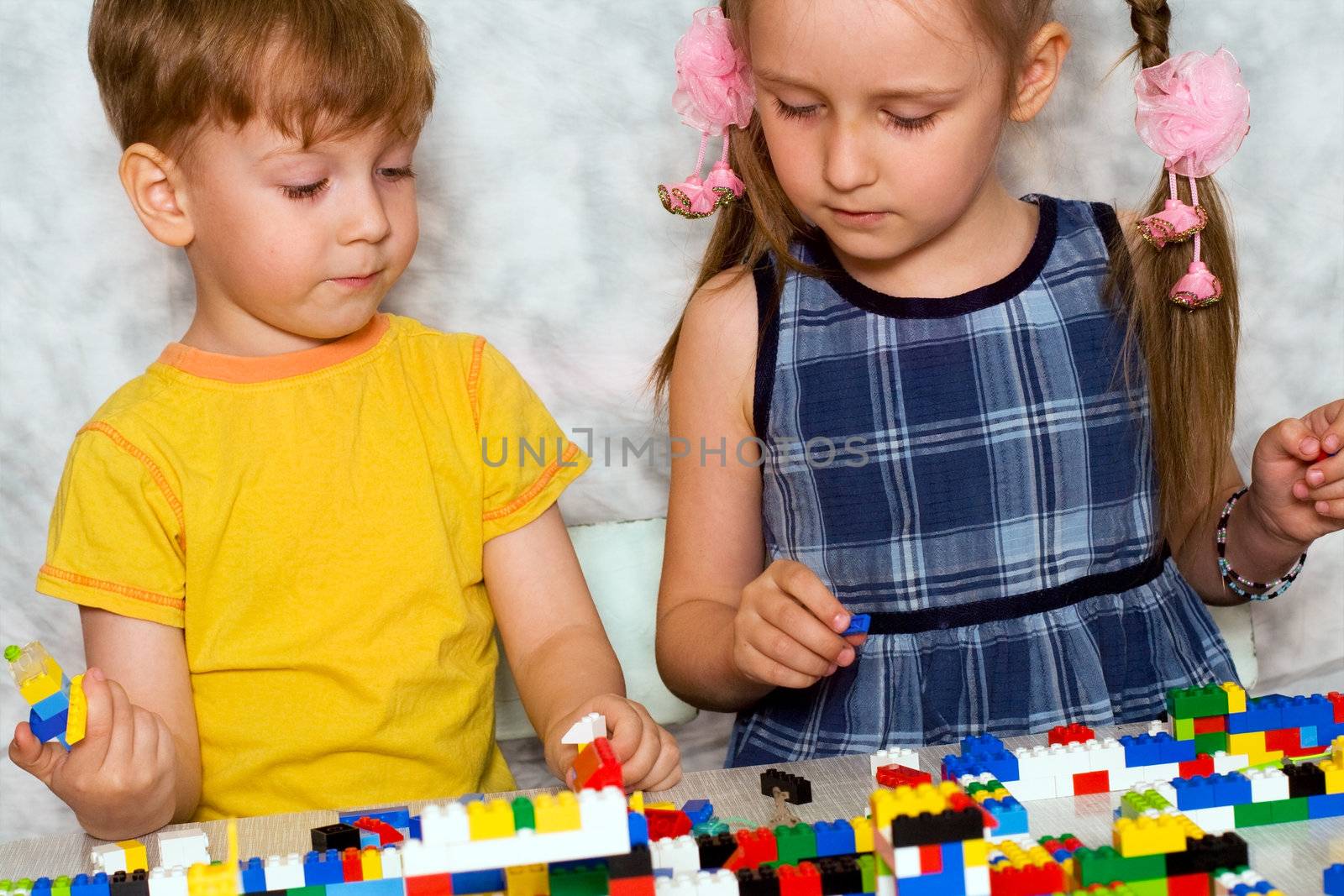 boy and girl builds a house out of