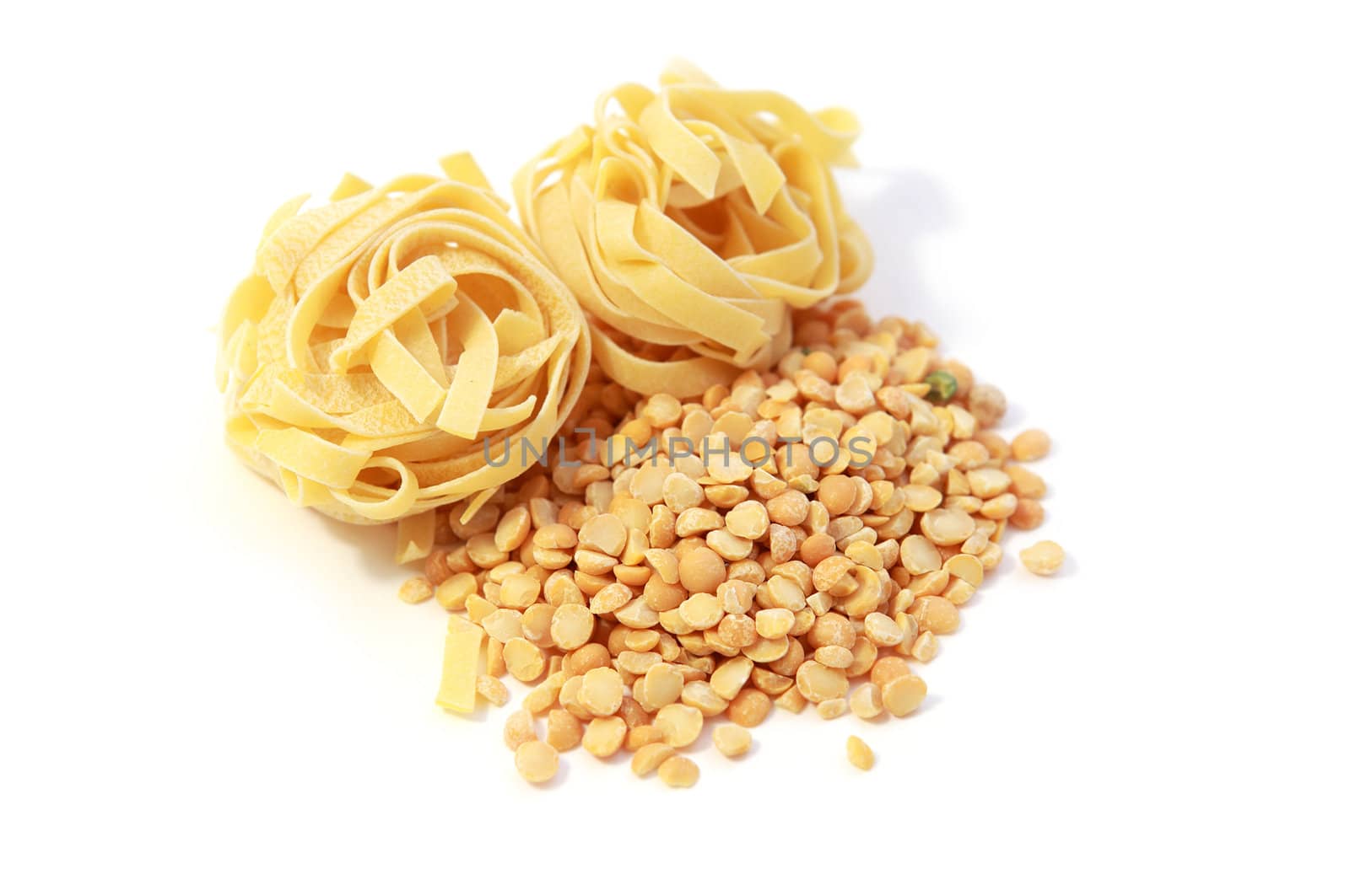 vegetarian menu - raw peas and noodles on white background