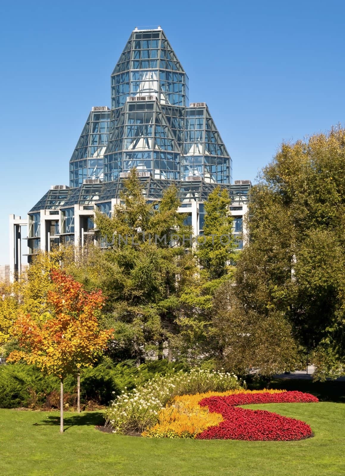 The National Gallery of Canada in Ottawa stands proud surrounded by flowers and autumn colors.