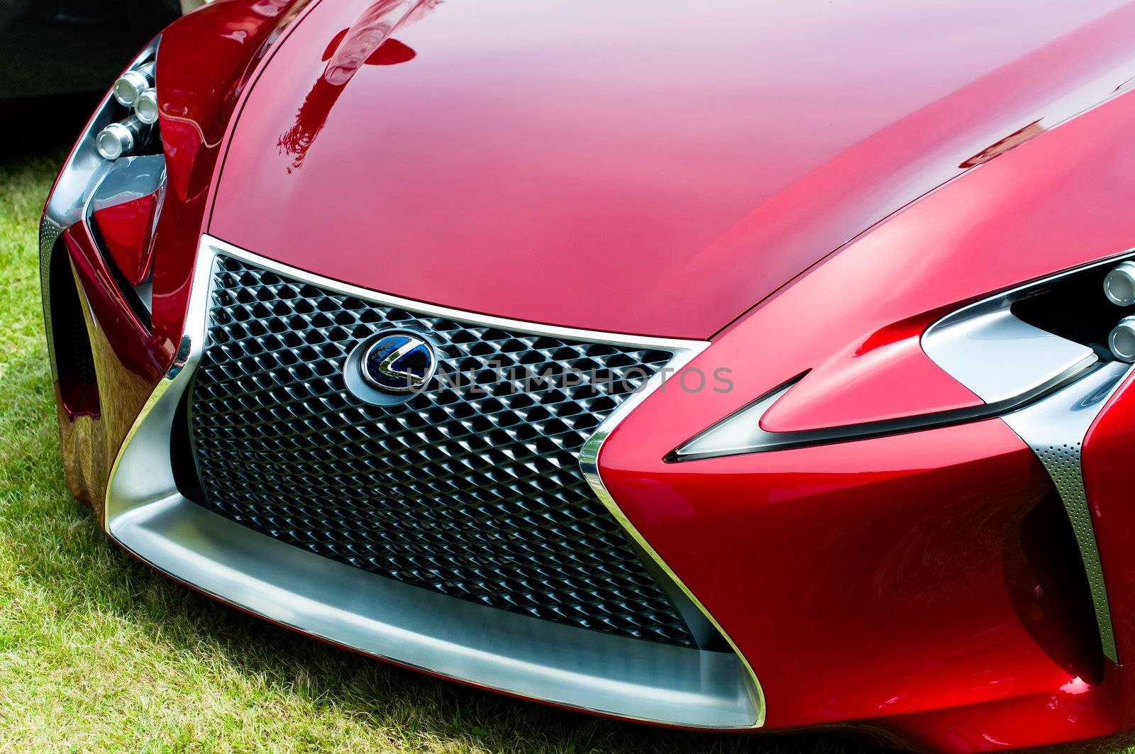 CERNOBBIO, LAKE COMO, ITALY – May 27: LEXUS showcasing their LF-Lc Concept car during the Concorso d'Eleganza Villa d'Este auto show in Cernobbio at the Lake Como in Italy on May 27, 2012. After making its world debut at the 2012 Detroit Auto Show, Lexus LF-Lc was presented again in Italy. The stunning Lexus LF-Lc Concept features a glass roof and an extensive remote touch-screen control board and infotainment touch screen display integrated into the doors. Concorso d'Eleganza Villa d'Este is a well renowned elegance competition for classic and vintage cars. It has taken place every year since 1929 and is also used by car manufacturers for presenting new prototypes.
