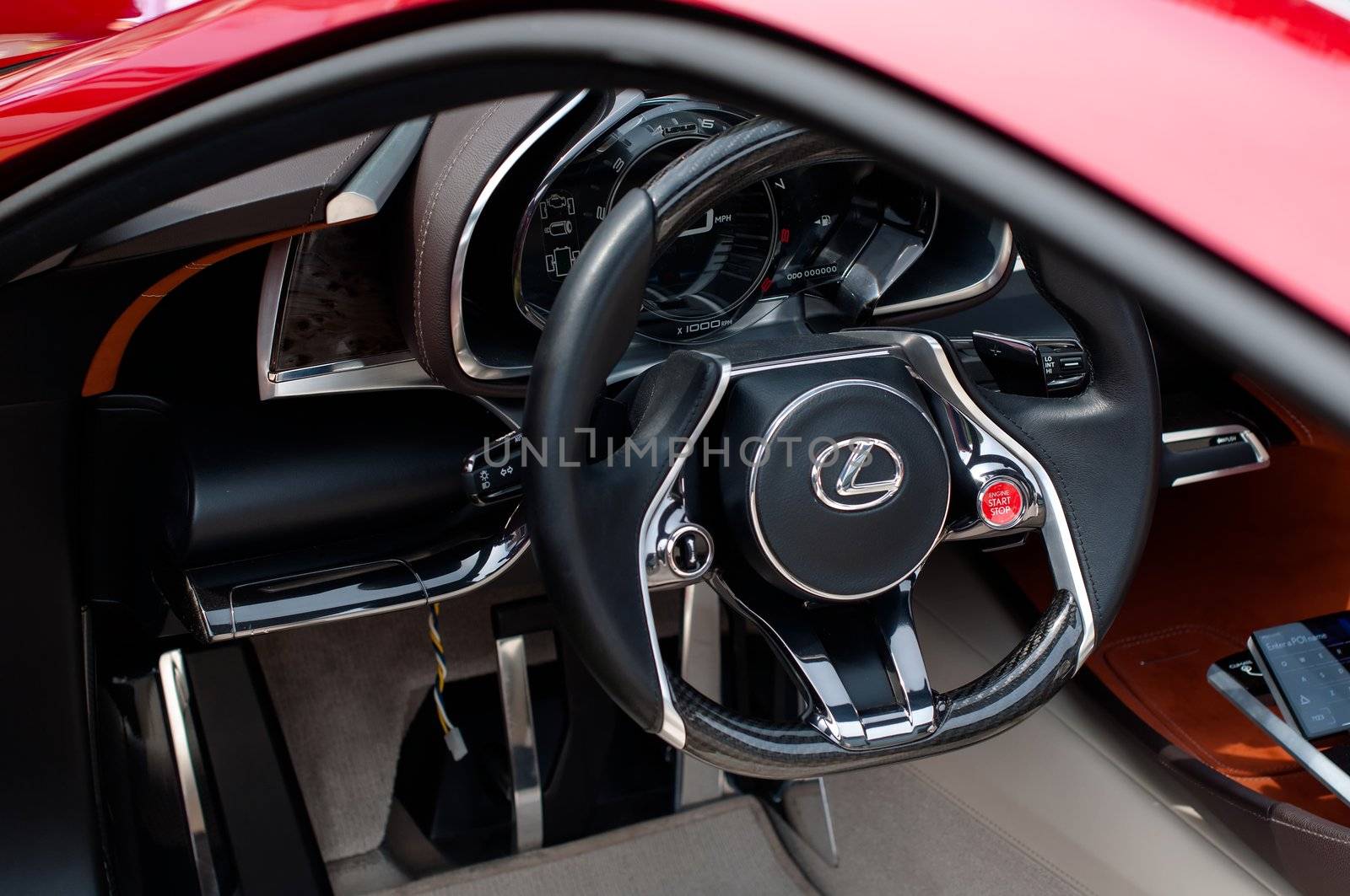CERNOBBIO, LAKE COMO, ITALY – May 27: LEXUS showcasing their LF-Lc Concept car during the Concorso d'Eleganza Villa d'Este auto show in Cernobbio at the Lake Como in Italy on May 27, 2012. After making its world debut at the 2012 Detroit Auto Show, Lexus LF-Lc was presented again in Italy. The stunning Lexus LF-Lc Concept features a glass roof and an extensive remote touch-screen control board and infotainment touch screen display integrated into the doors. Concorso d'Eleganza Villa d'Este is a well renowned elegance competition for classic and vintage cars. It has taken place every year since 1929 and is also used by car manufacturers for presenting new prototypes.