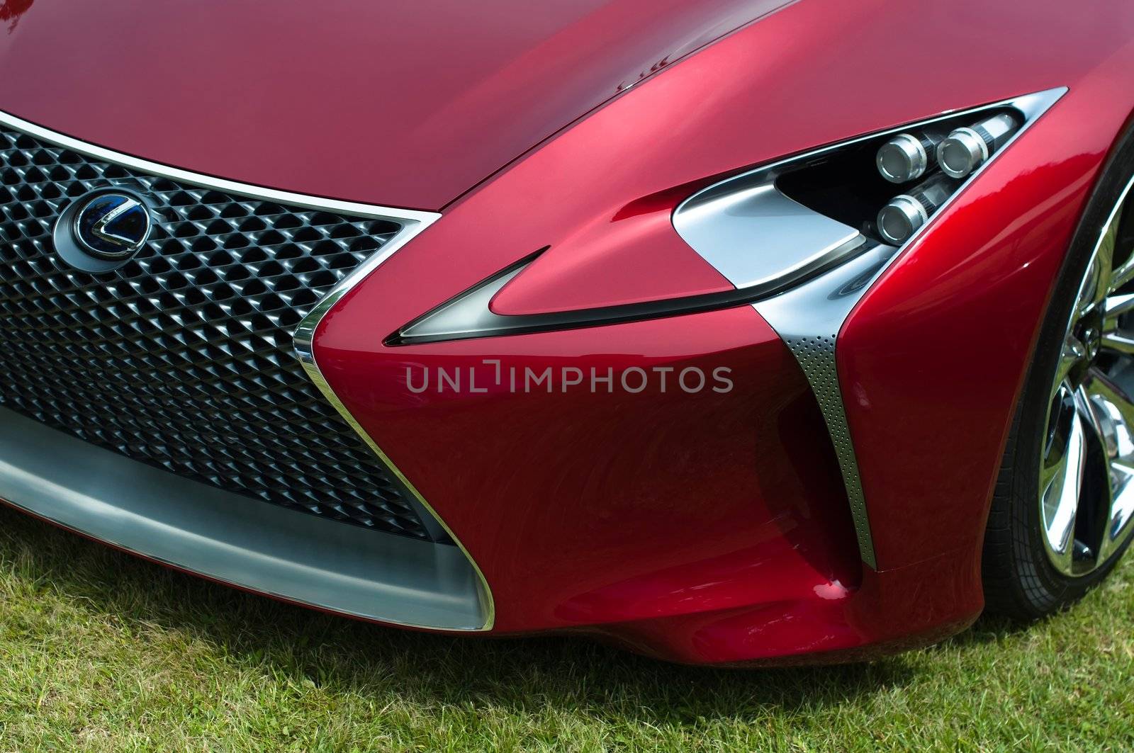 CERNOBBIO, LAKE COMO, ITALY – May 27: LEXUS showcasing their LF-Lc Concept car during the Concorso d'Eleganza Villa d'Este auto show in Cernobbio at the Lake Como in Italy on May 27, 2012. After making its world debut at the 2012 Detroit Auto Show, Lexus LF-Lc was presented again in Italy. The stunning Lexus LF-Lc Concept features a glass roof and an extensive remote touch-screen control board and infotainment touch screen display integrated into the doors. Concorso d'Eleganza Villa d'Este is a well renowned elegance competition for classic and vintage cars. It has taken place every year since 1929 and is also used by car manufacturers for presenting new prototypes.