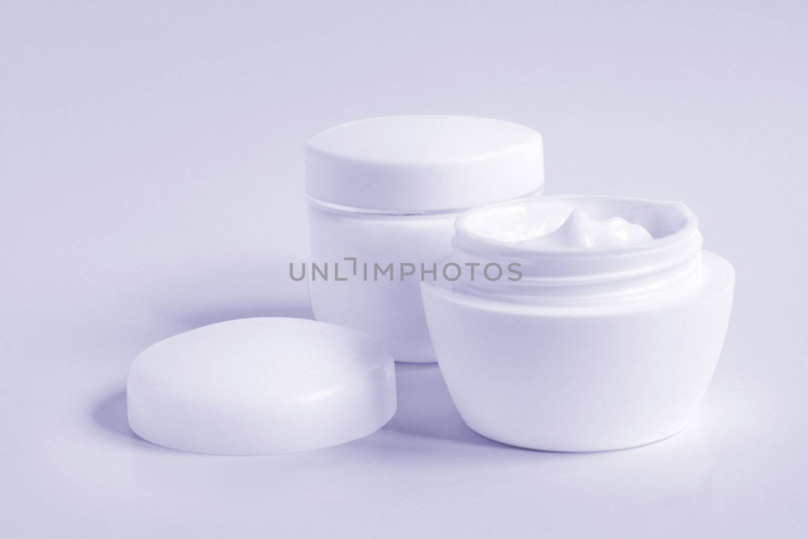 Containers of a different cosmetic creams. Close-up of a face cream.
