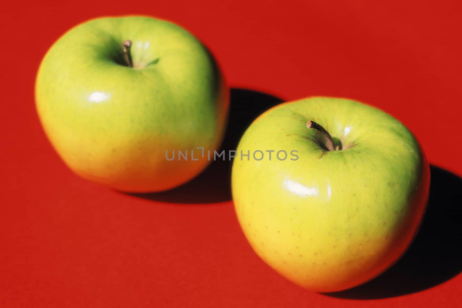 Two green apples by Baltus