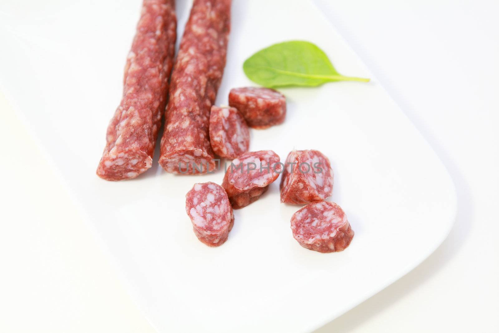 traditional Dutch sausages from dry meat on white plate