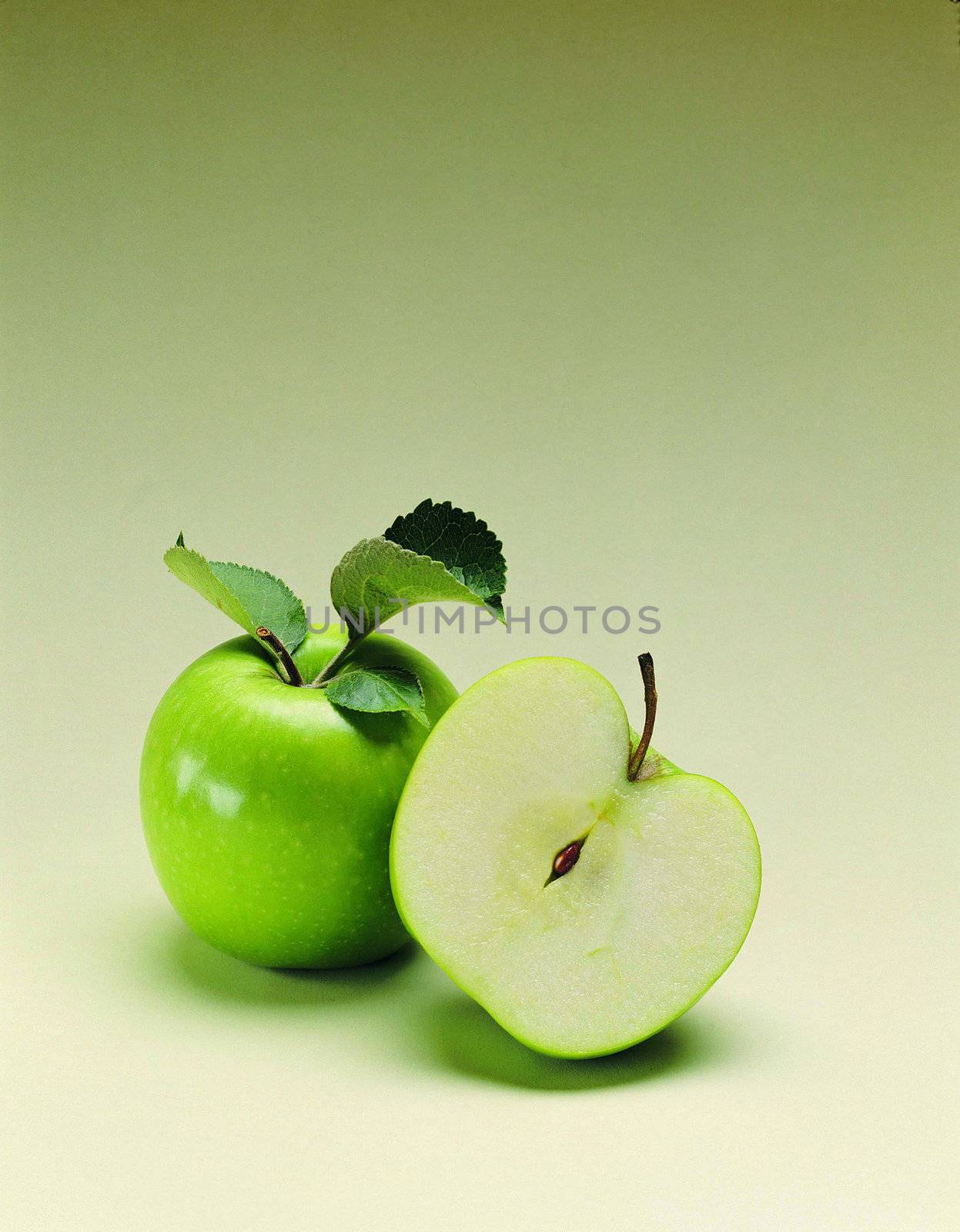 Ripe green apple with slices