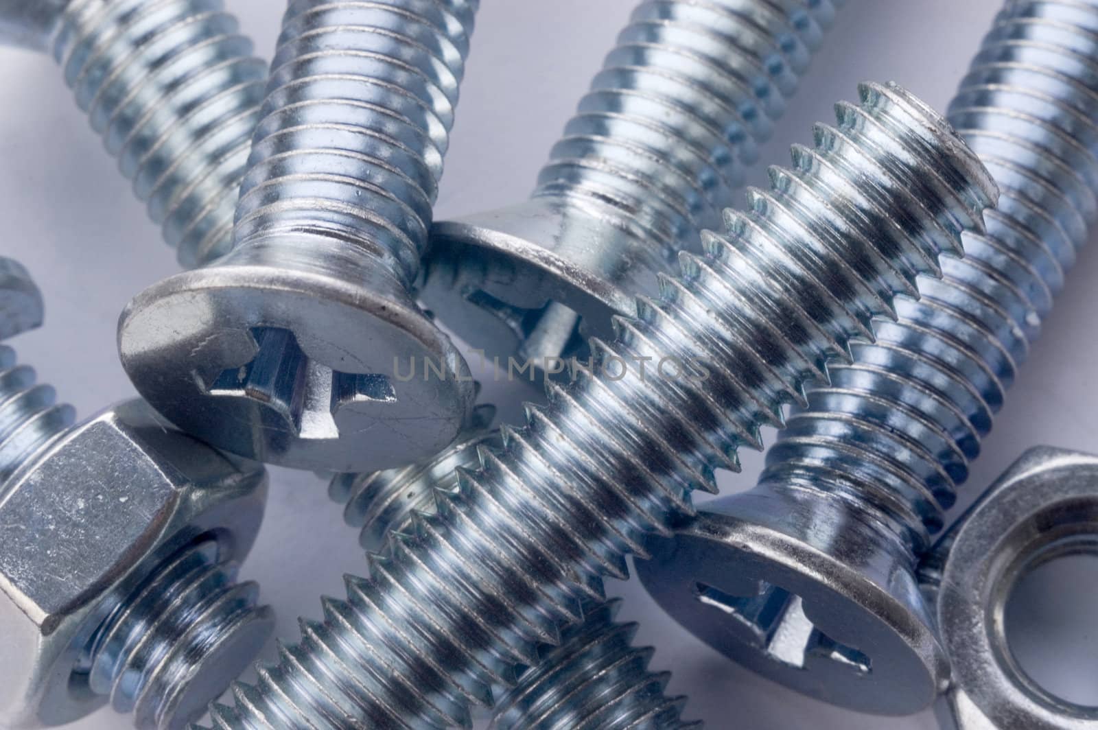 The large bolts and screws on a white background.